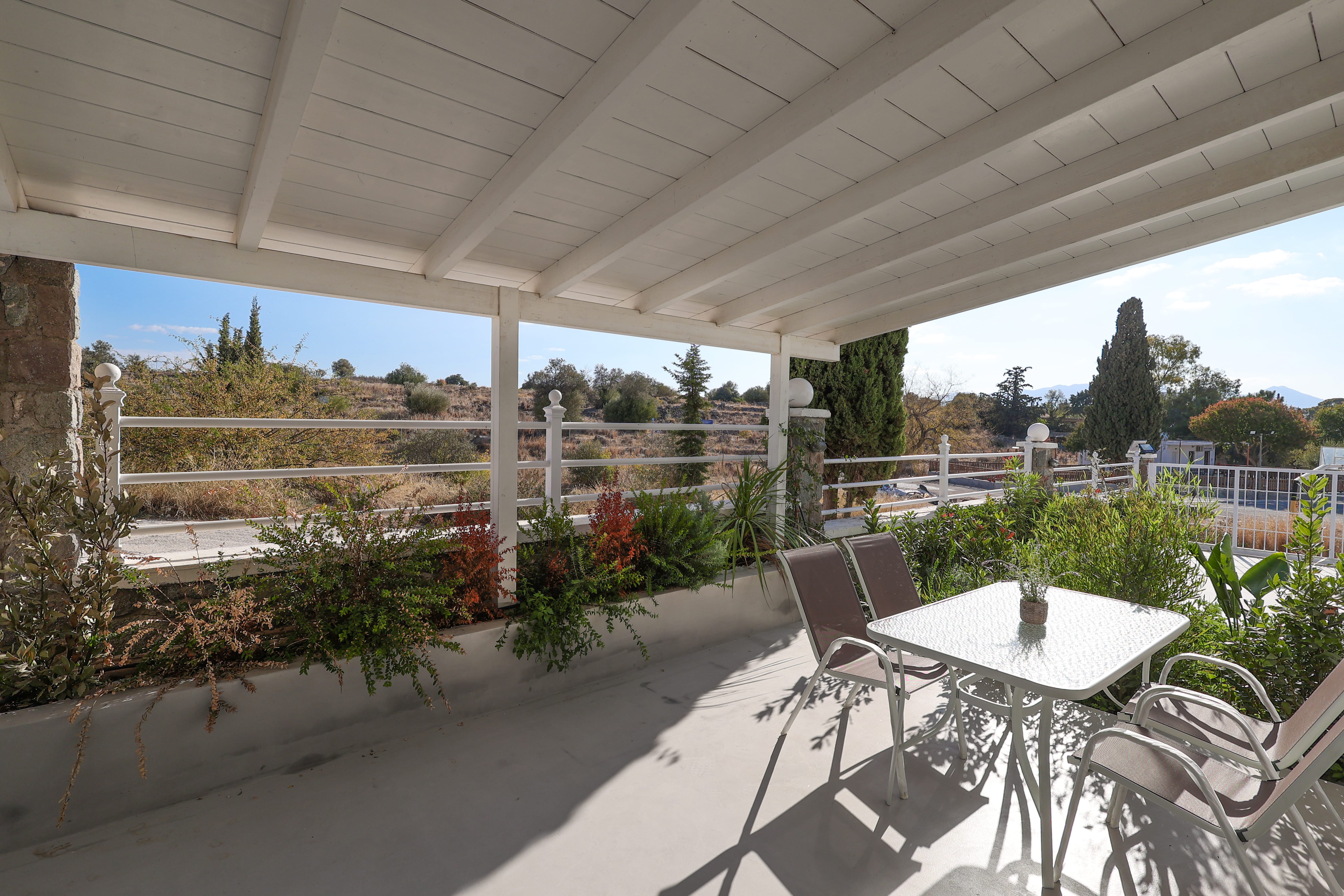 a table and chairs on a patio