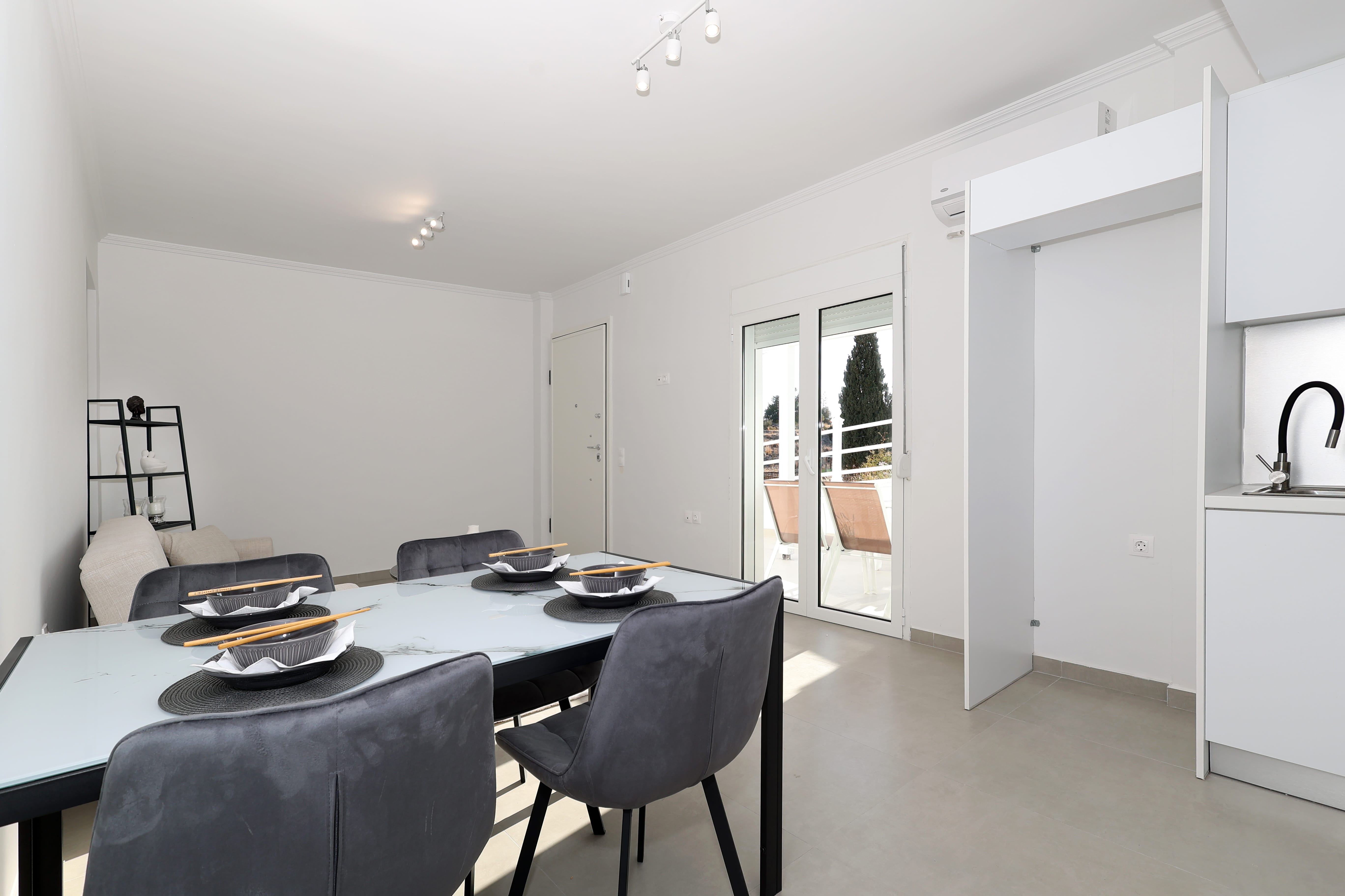 a dining room with a table and chairs