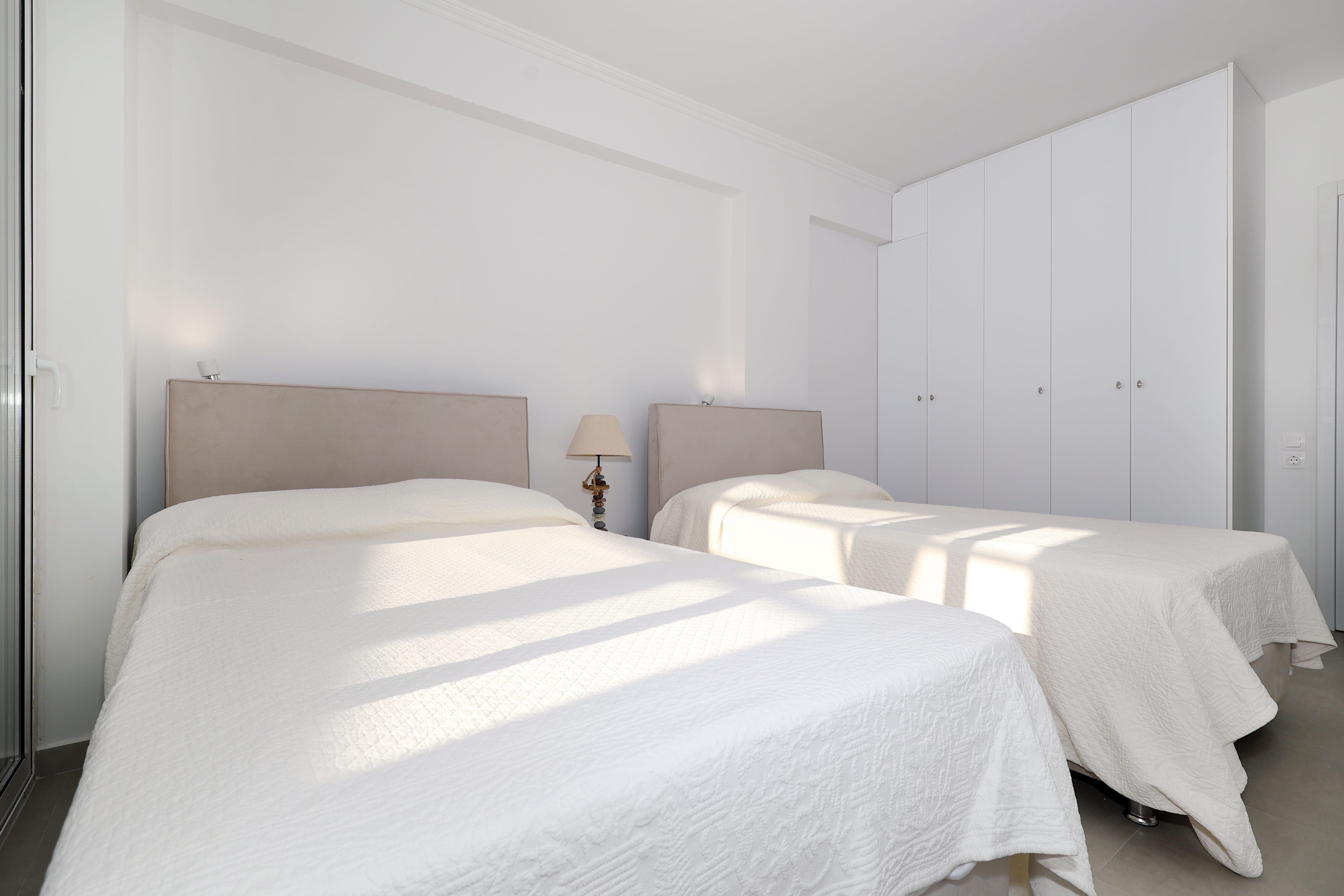 a couple of beds in a room