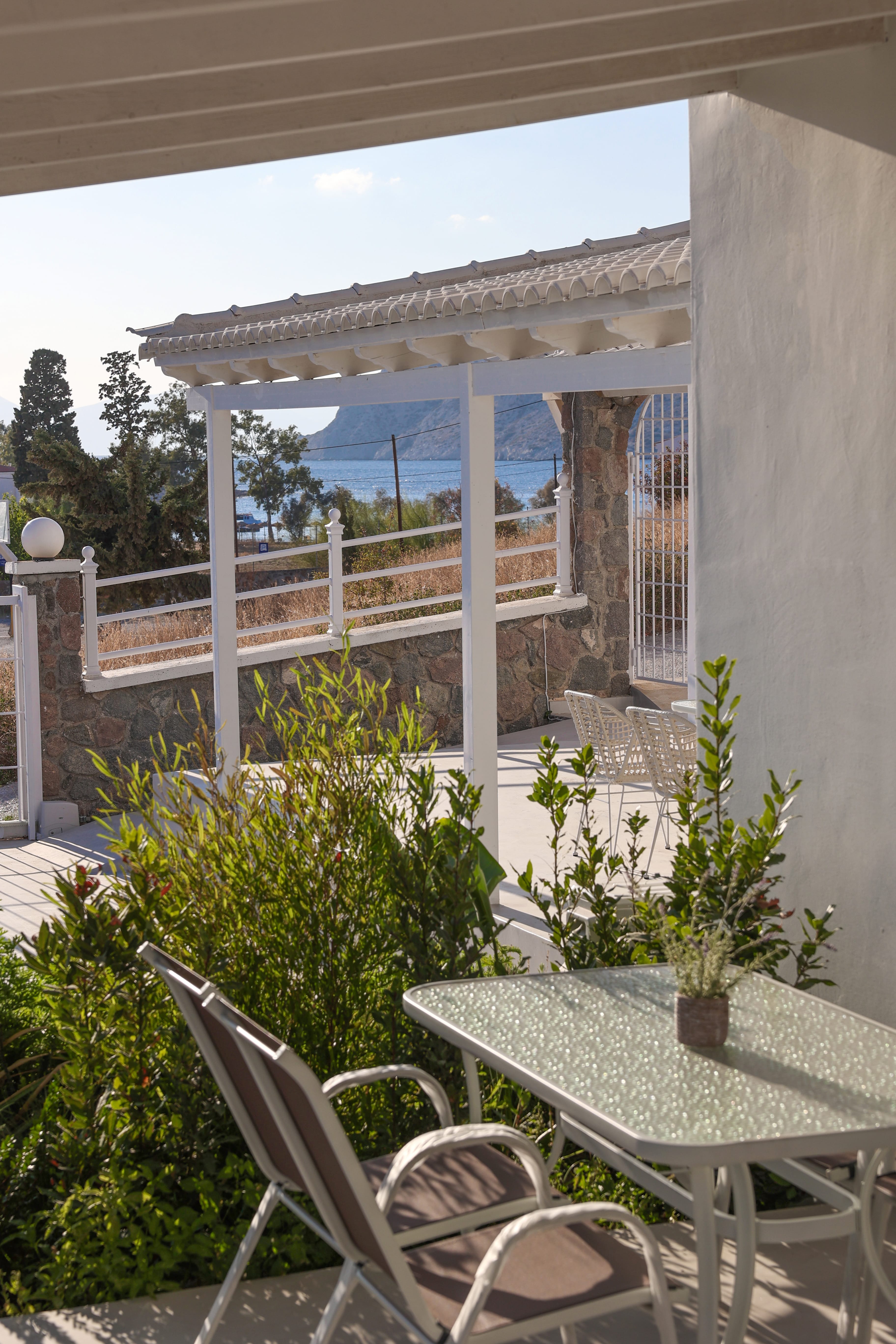 a patio with a table and chairs