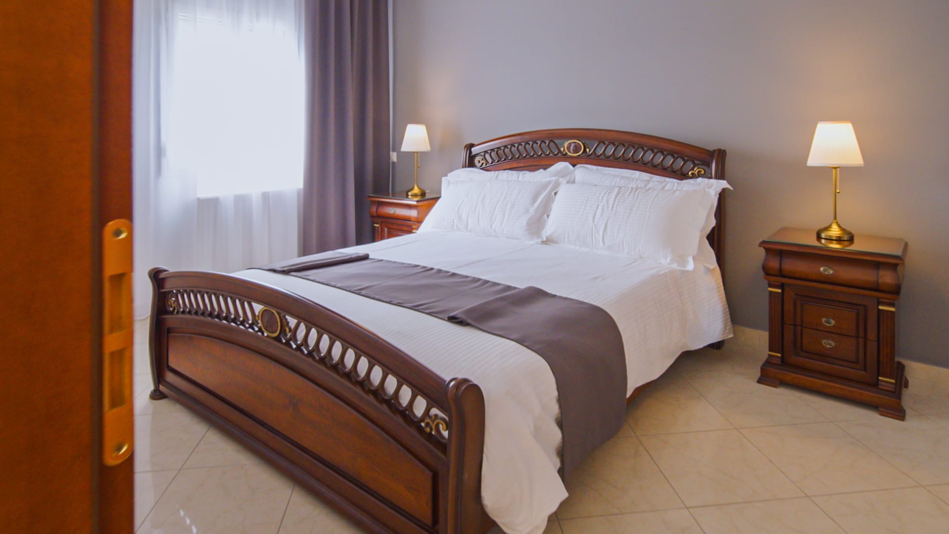 a bed with a black and white comforter