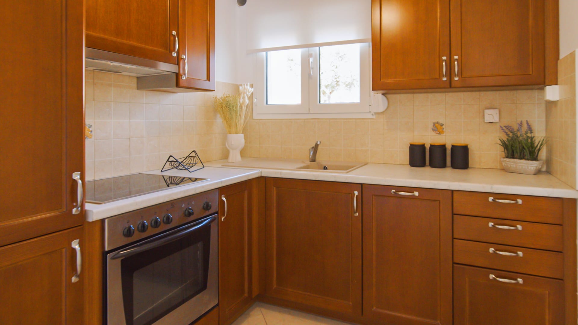 a kitchen with wooden cabinets