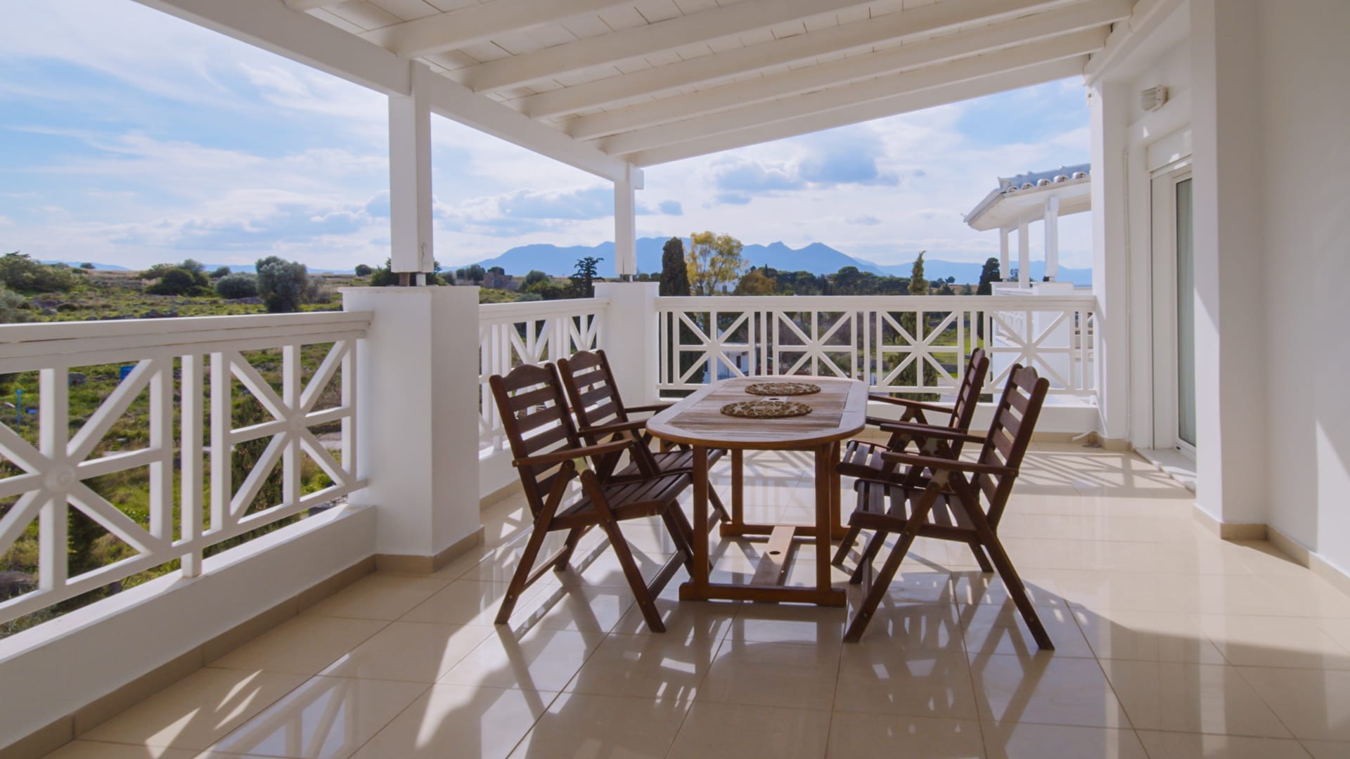 a table and chairs on a deck