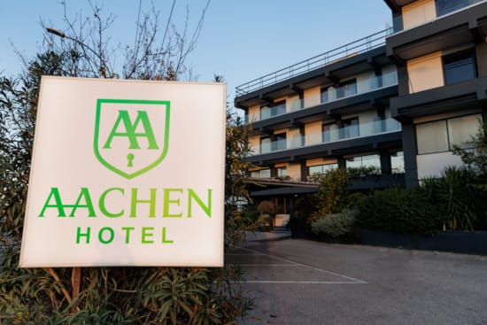 a sign in front of a building