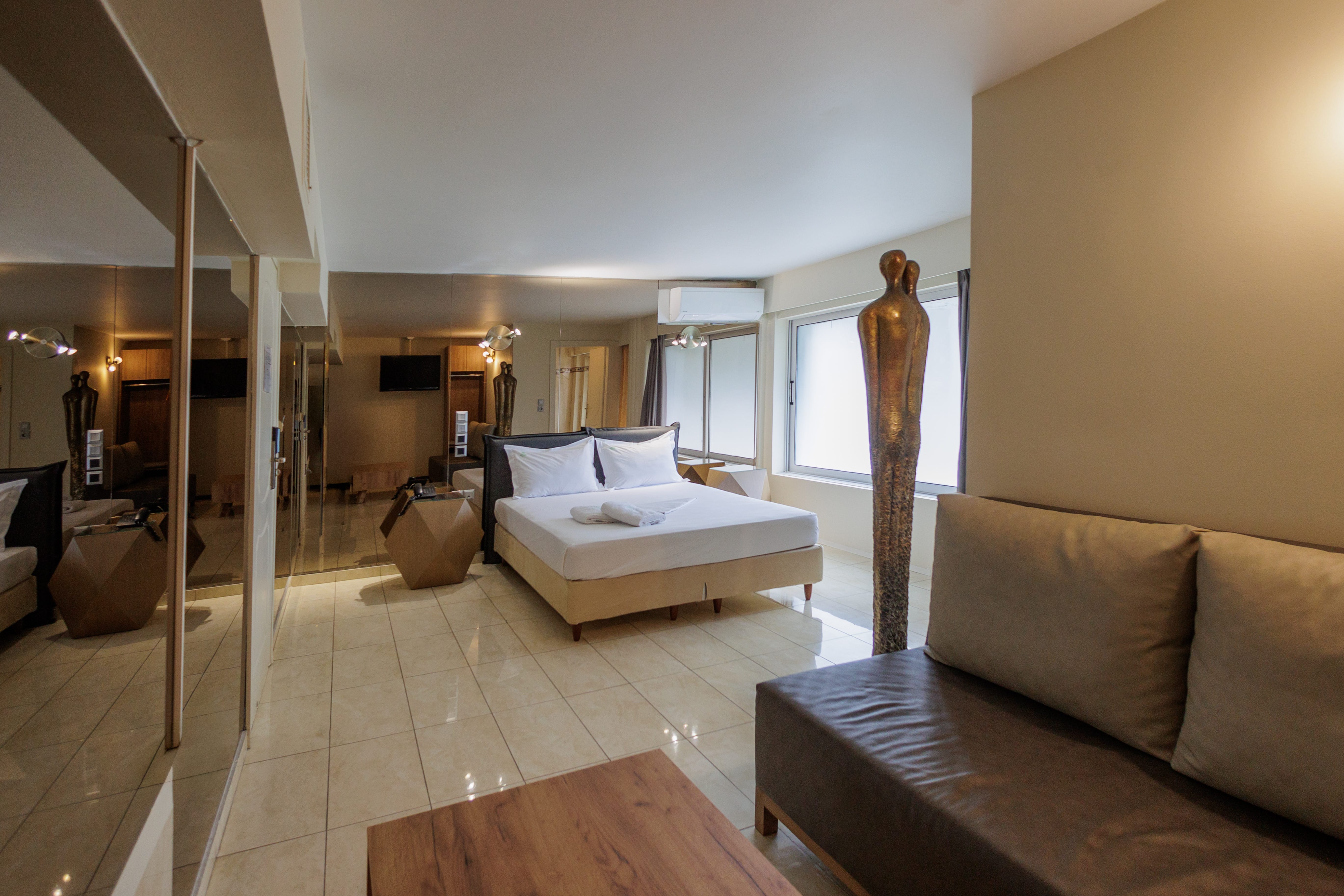 a living room with a couch and a bed