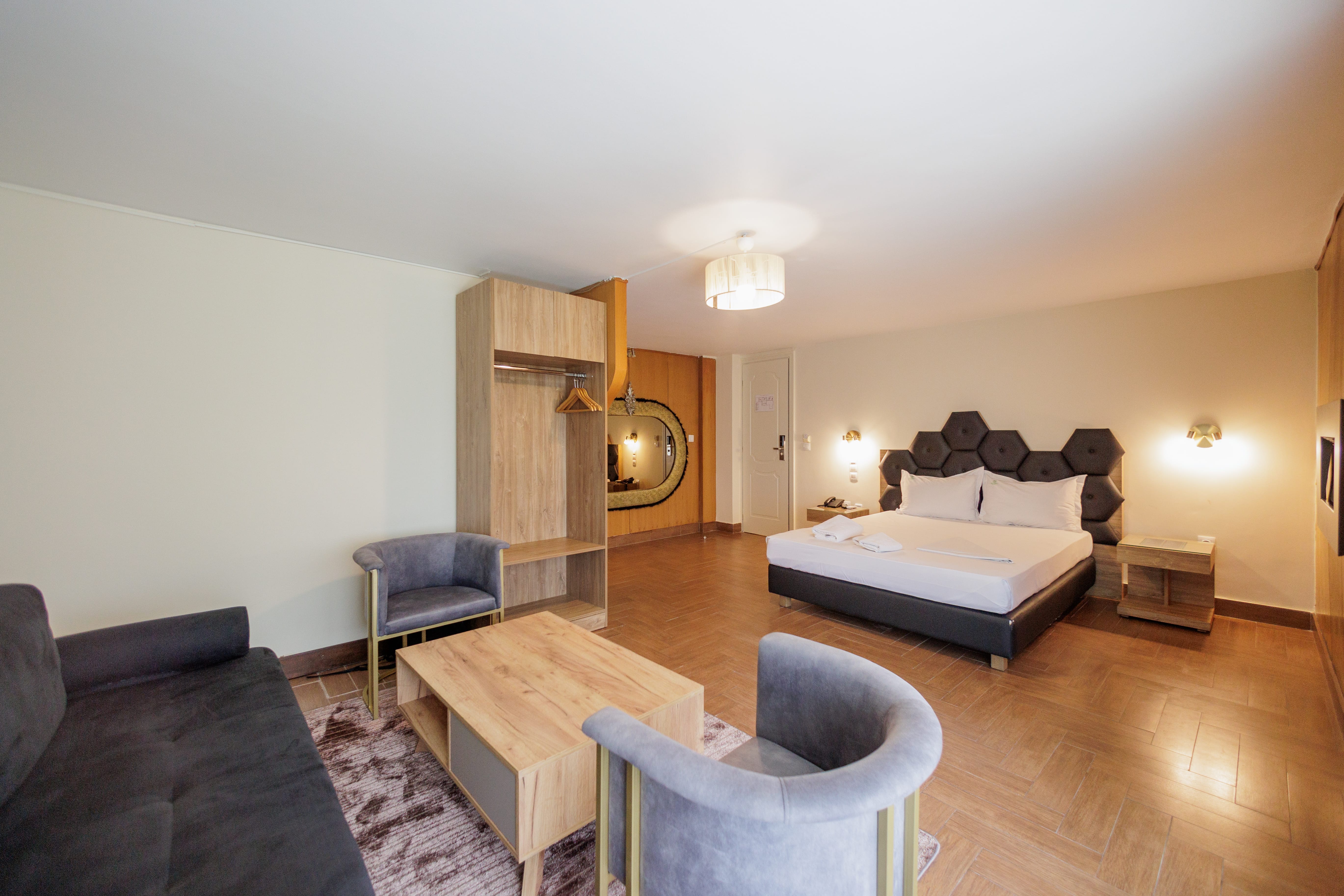 a living room with a couch and chairs