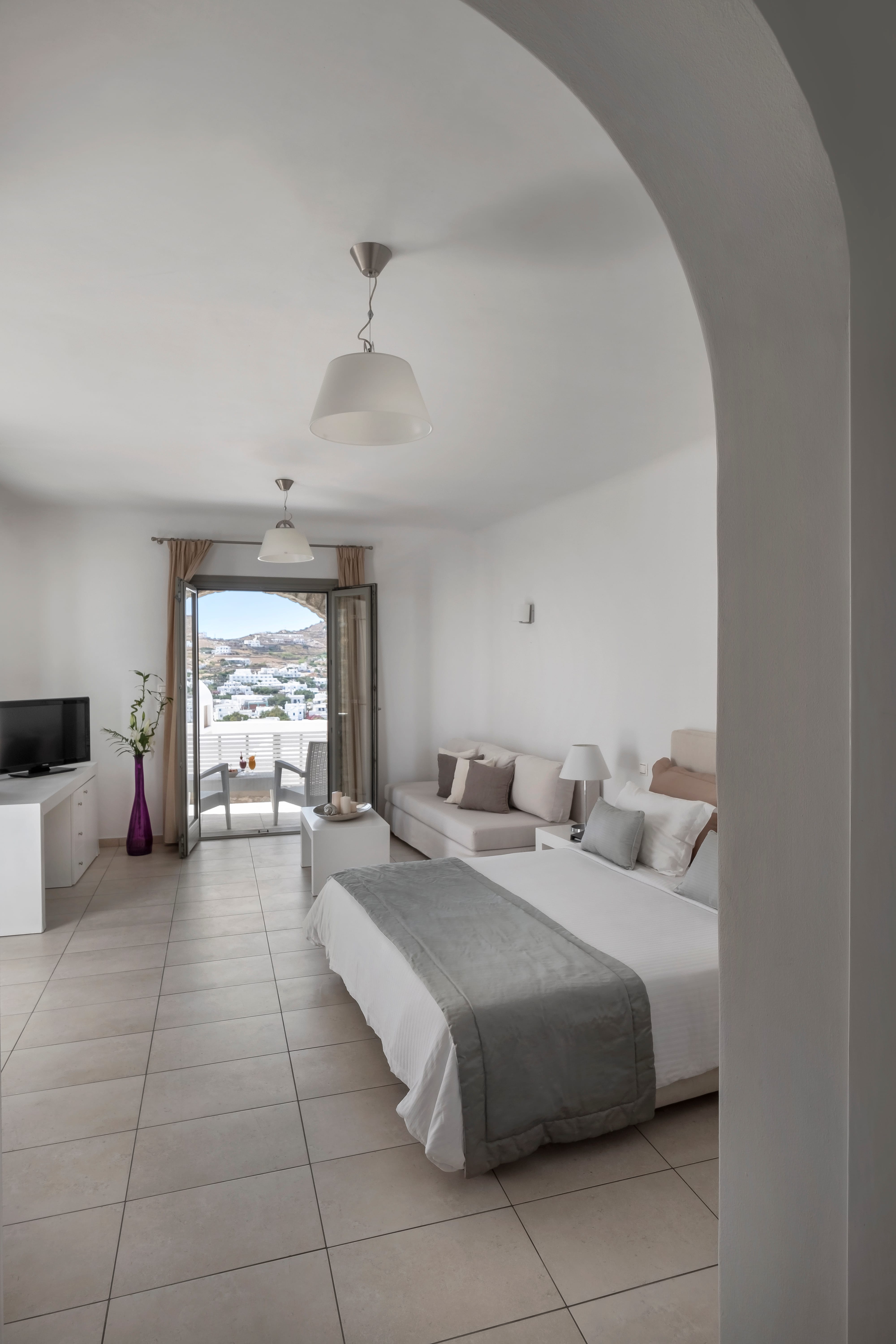 a bedroom with a large window