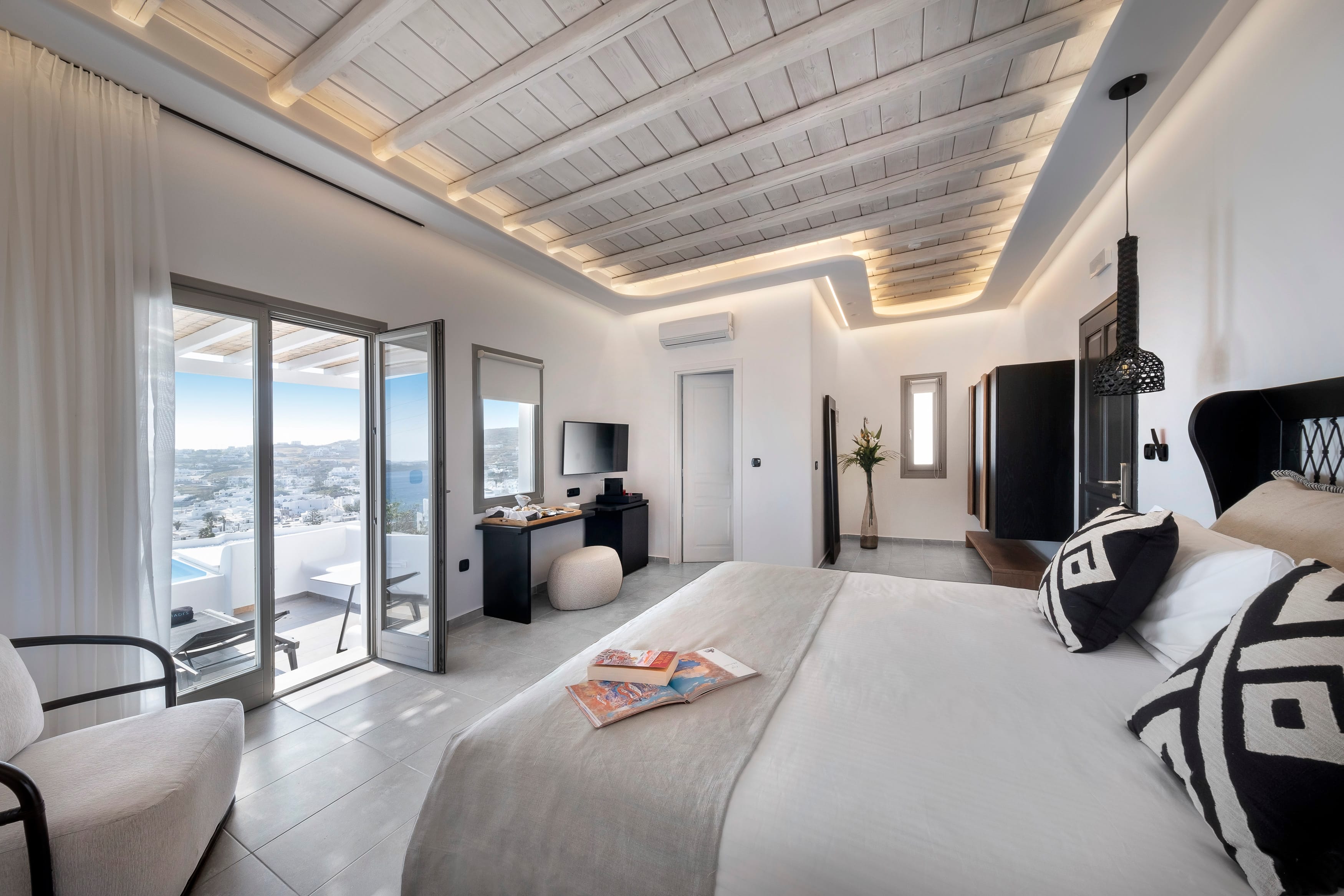 a bedroom with a large glass door