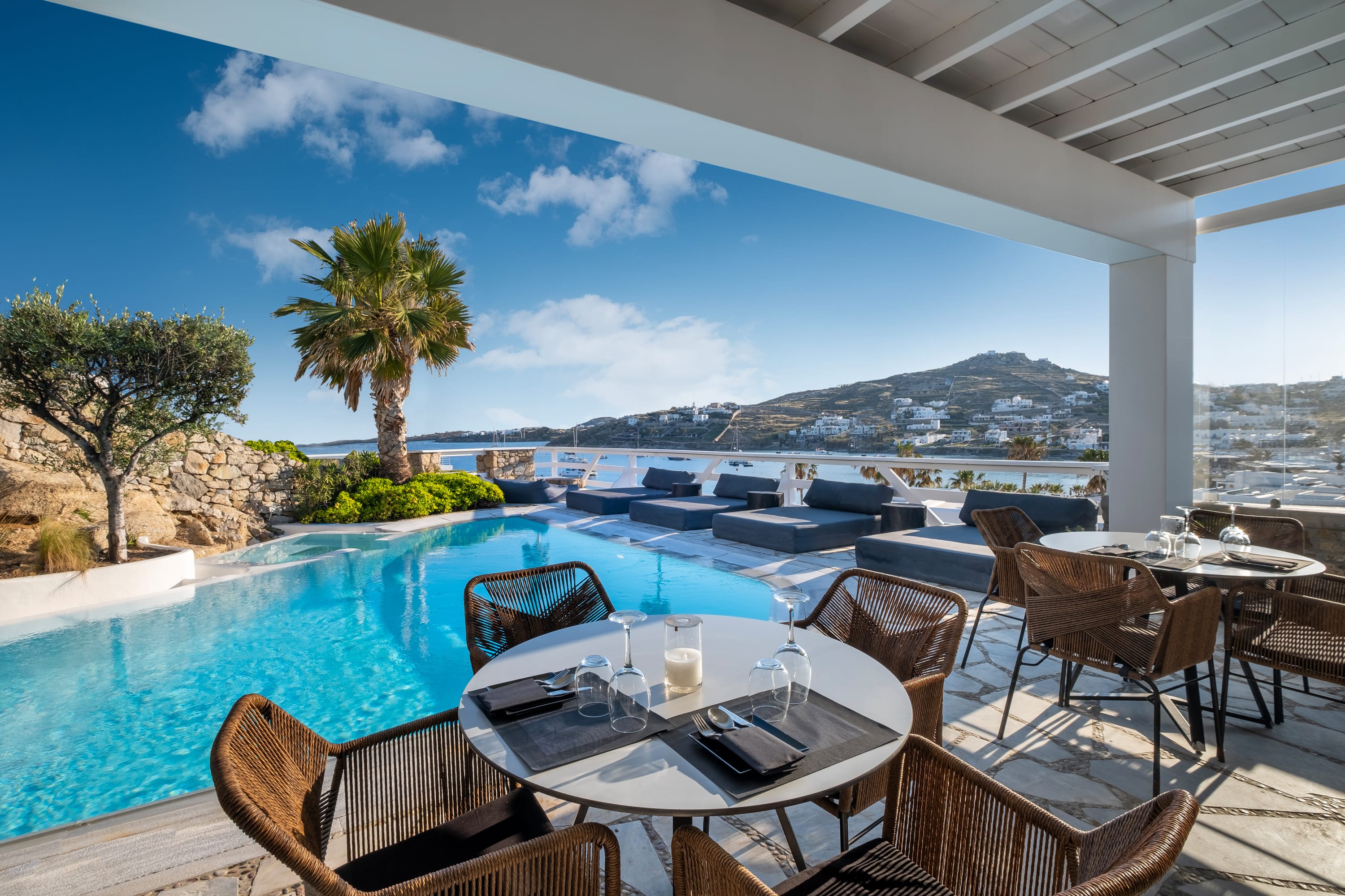 a pool with chairs and tables