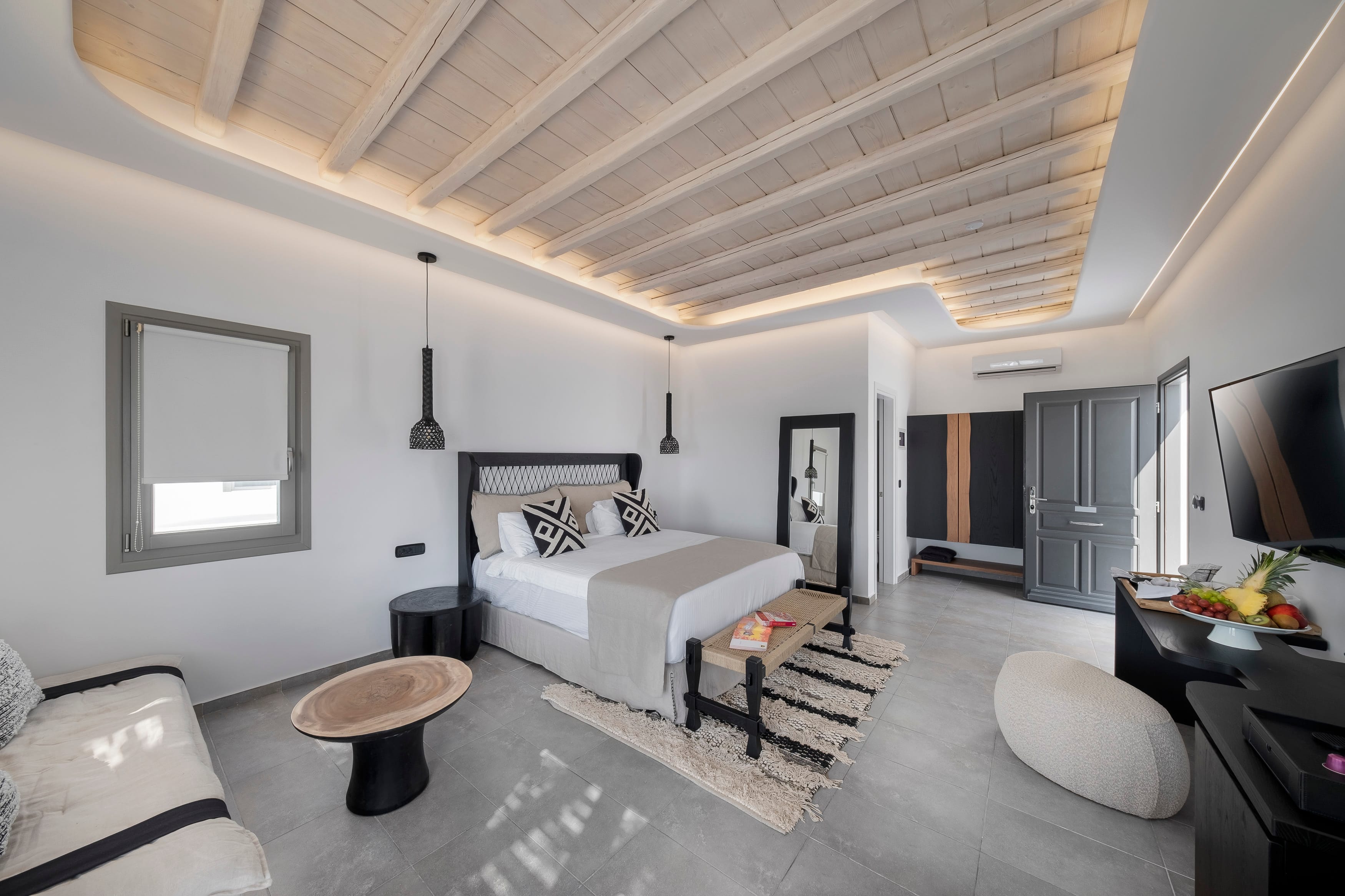 a living room with a white couch and a white table