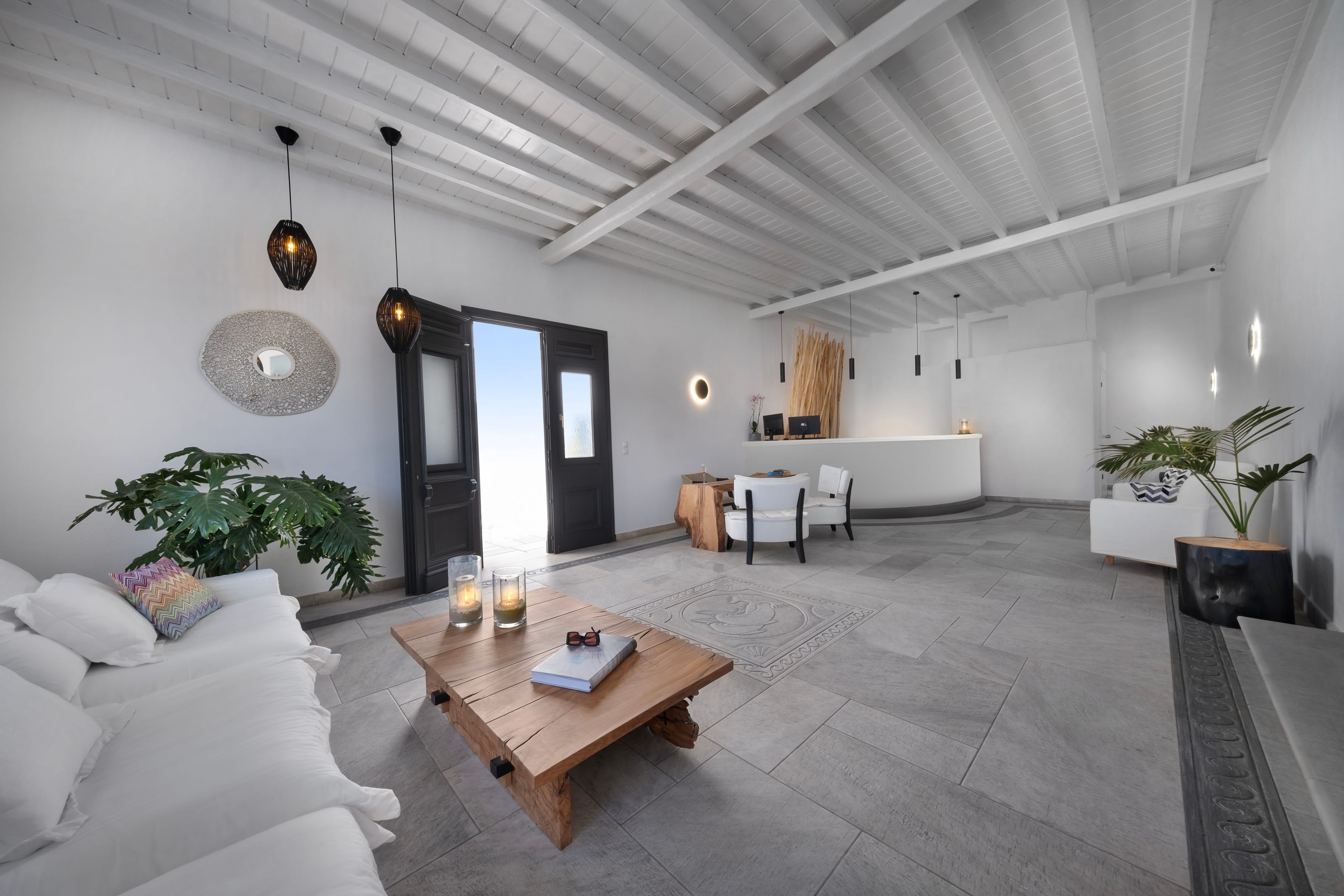 a living room with a table and chairs