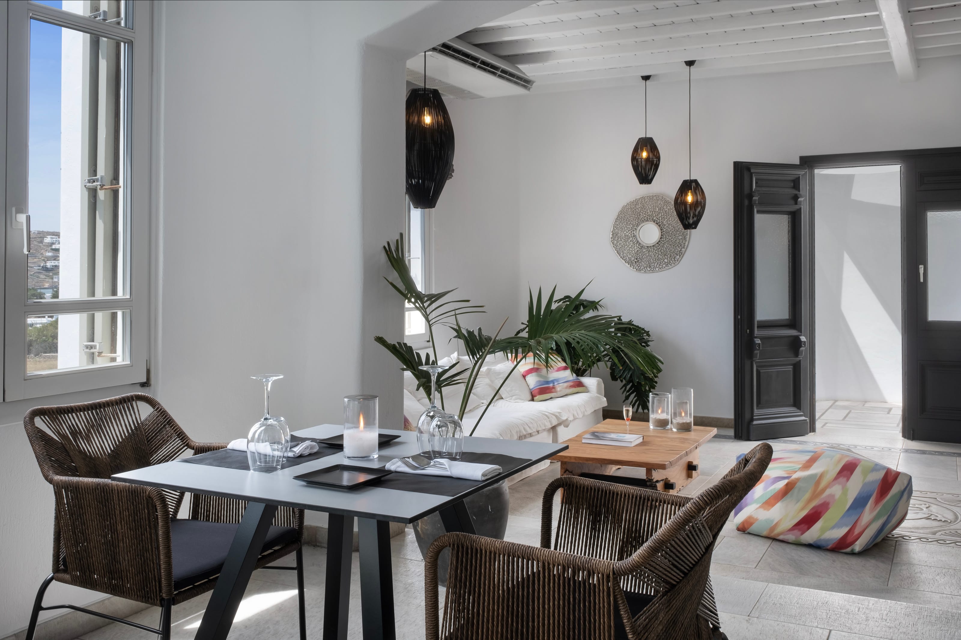 a dining room table with chairs and a plant on it