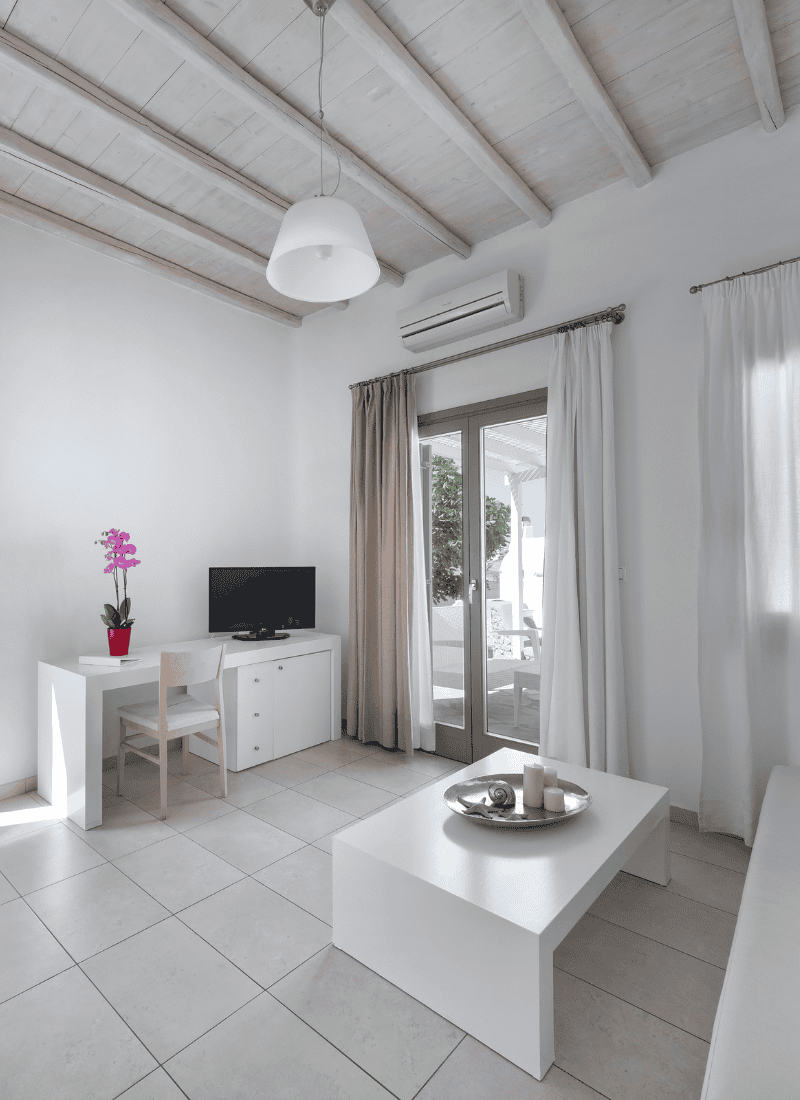 a room with a table and chairs