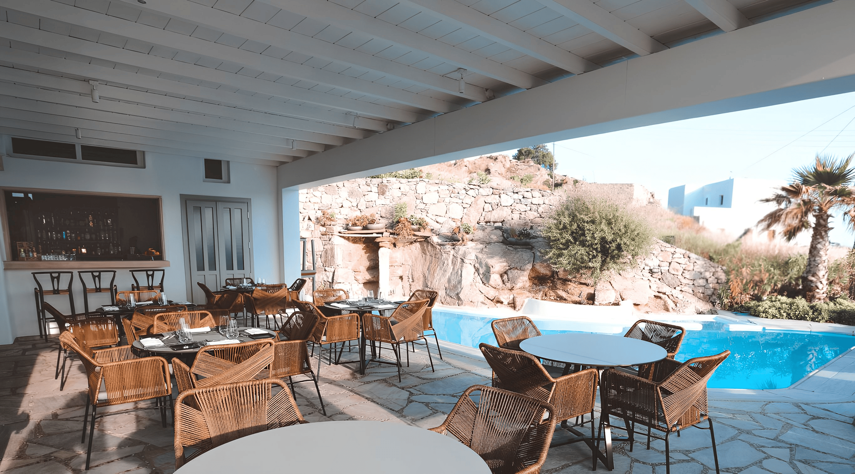 a pool with chairs around it