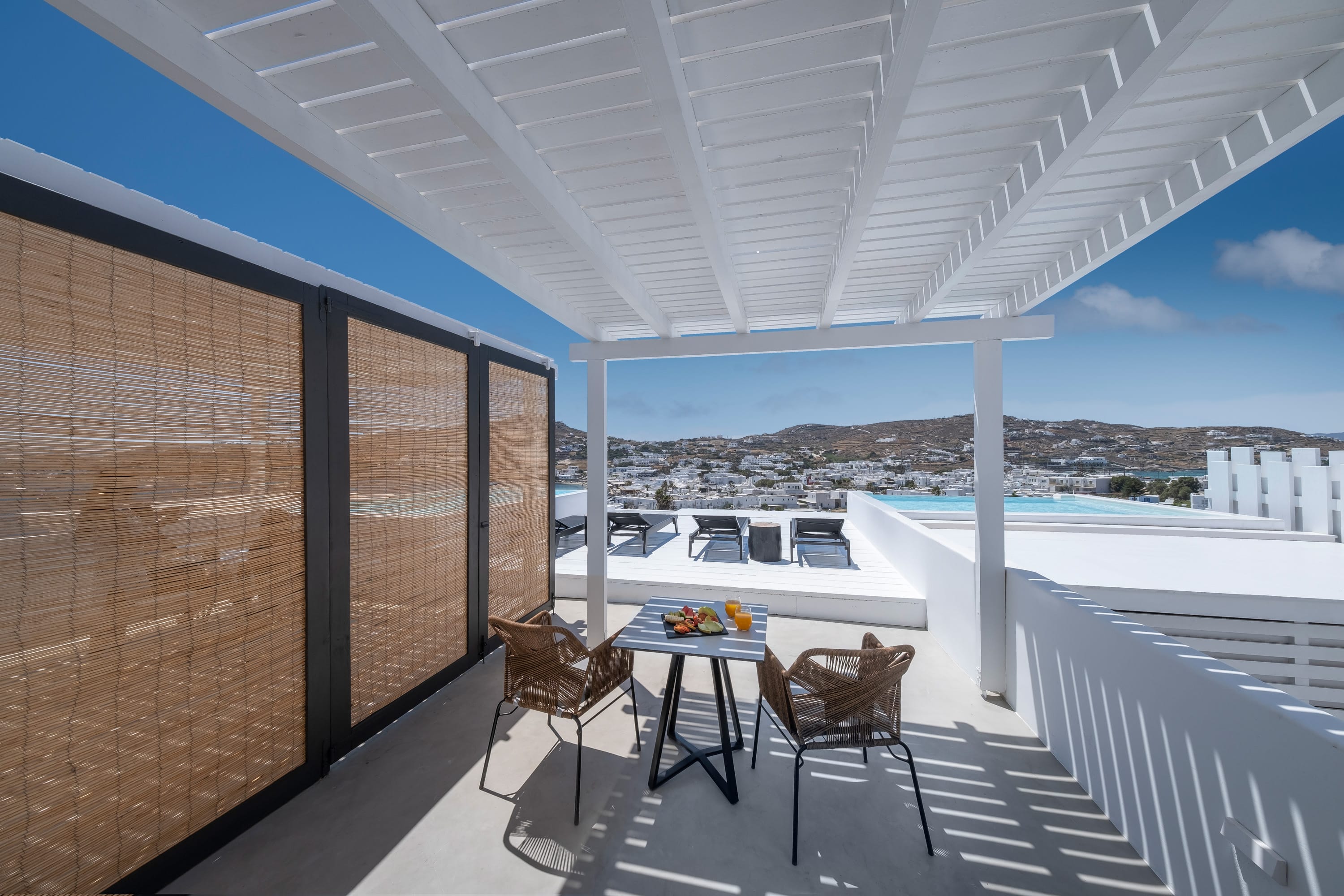a table and chairs on a deck