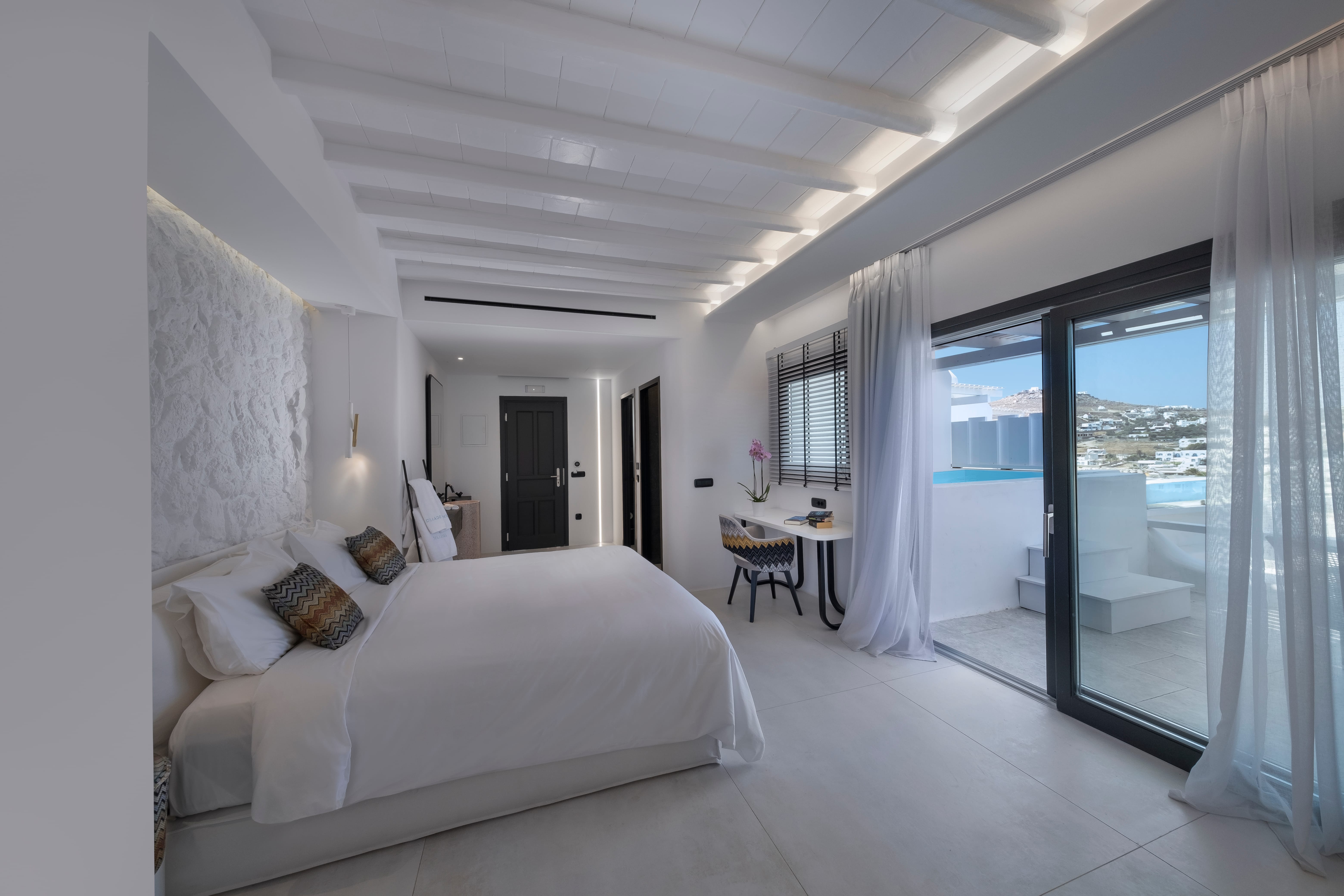 a bedroom with a bed and a table