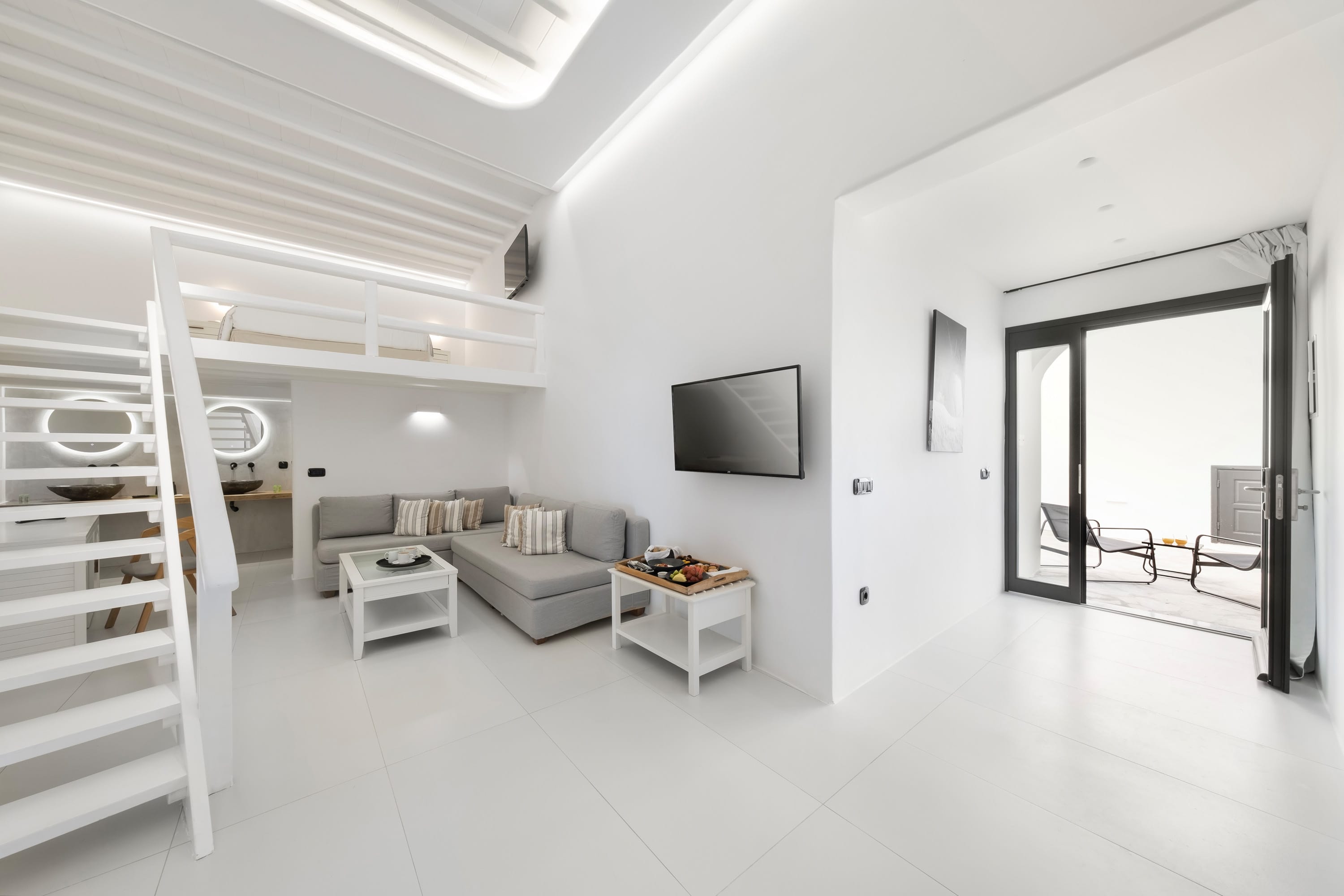 a living room with a tv and a couch