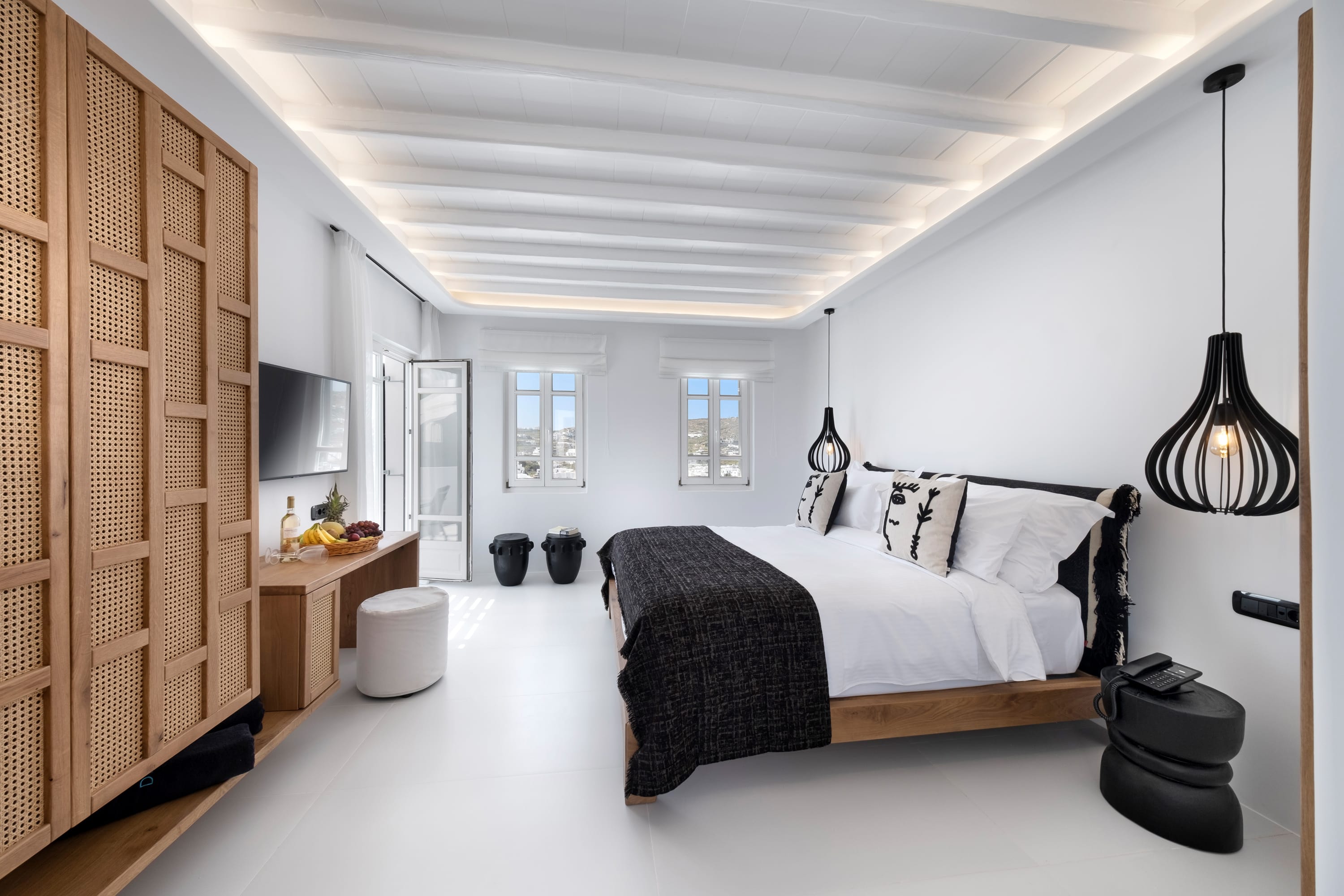 a bedroom with a bed and a lamp