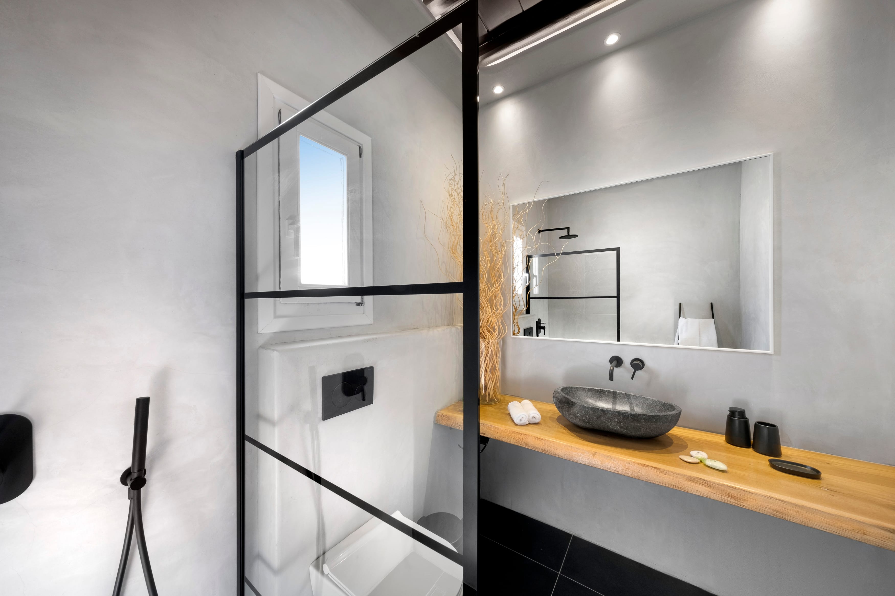 a bathroom with a mirror and sink