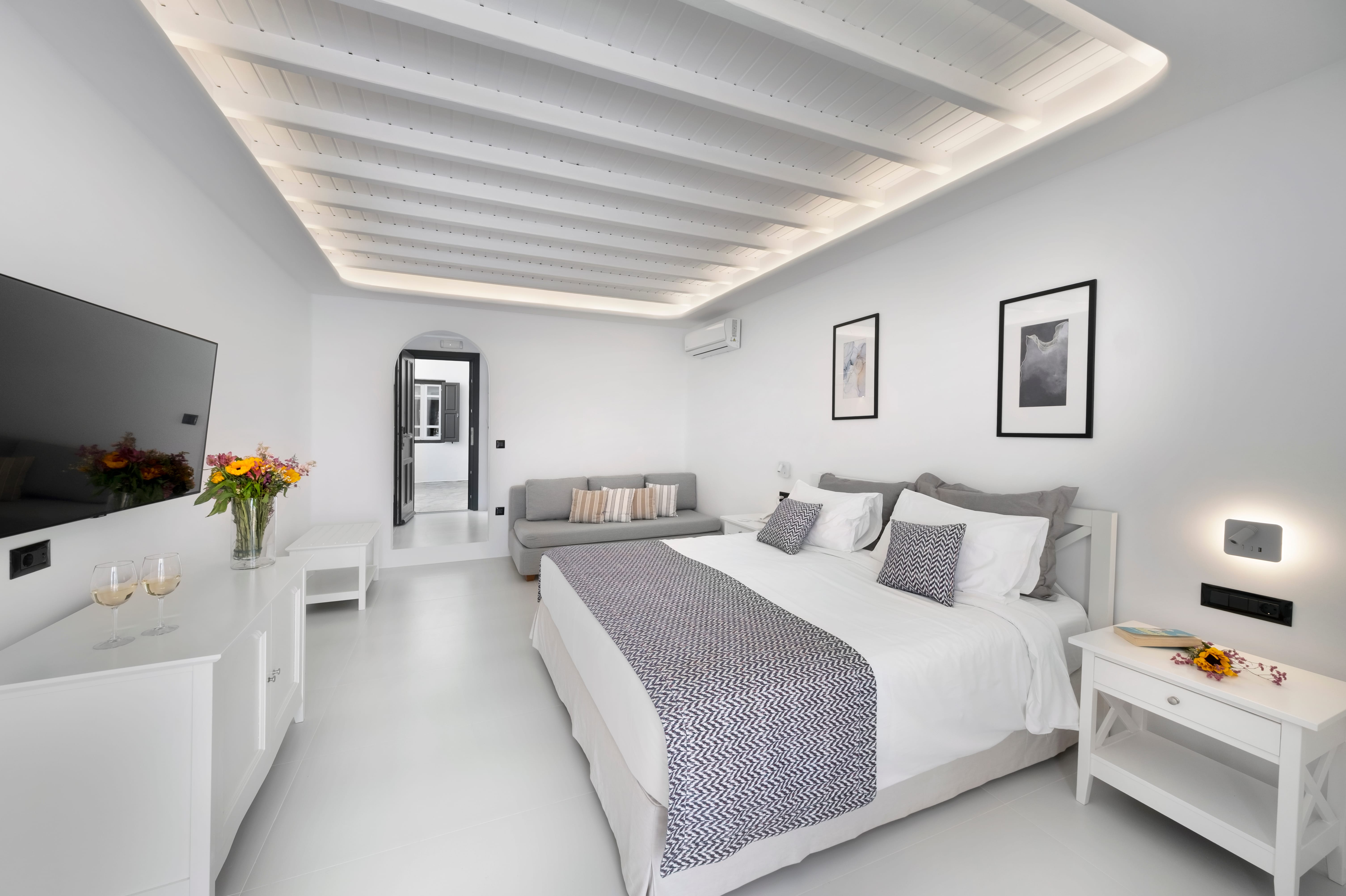 a bedroom with a bed and a table