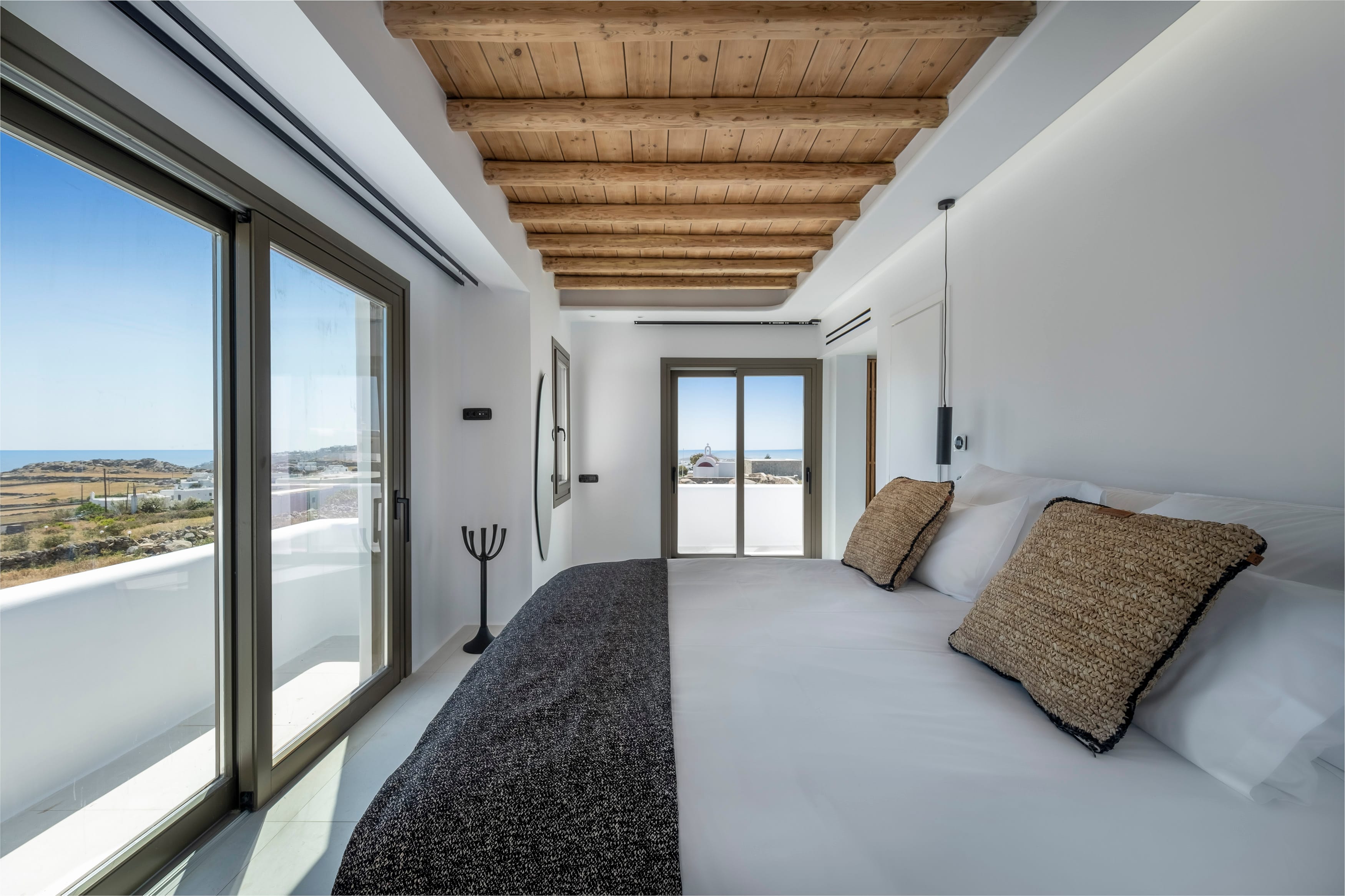 a bedroom with a large window