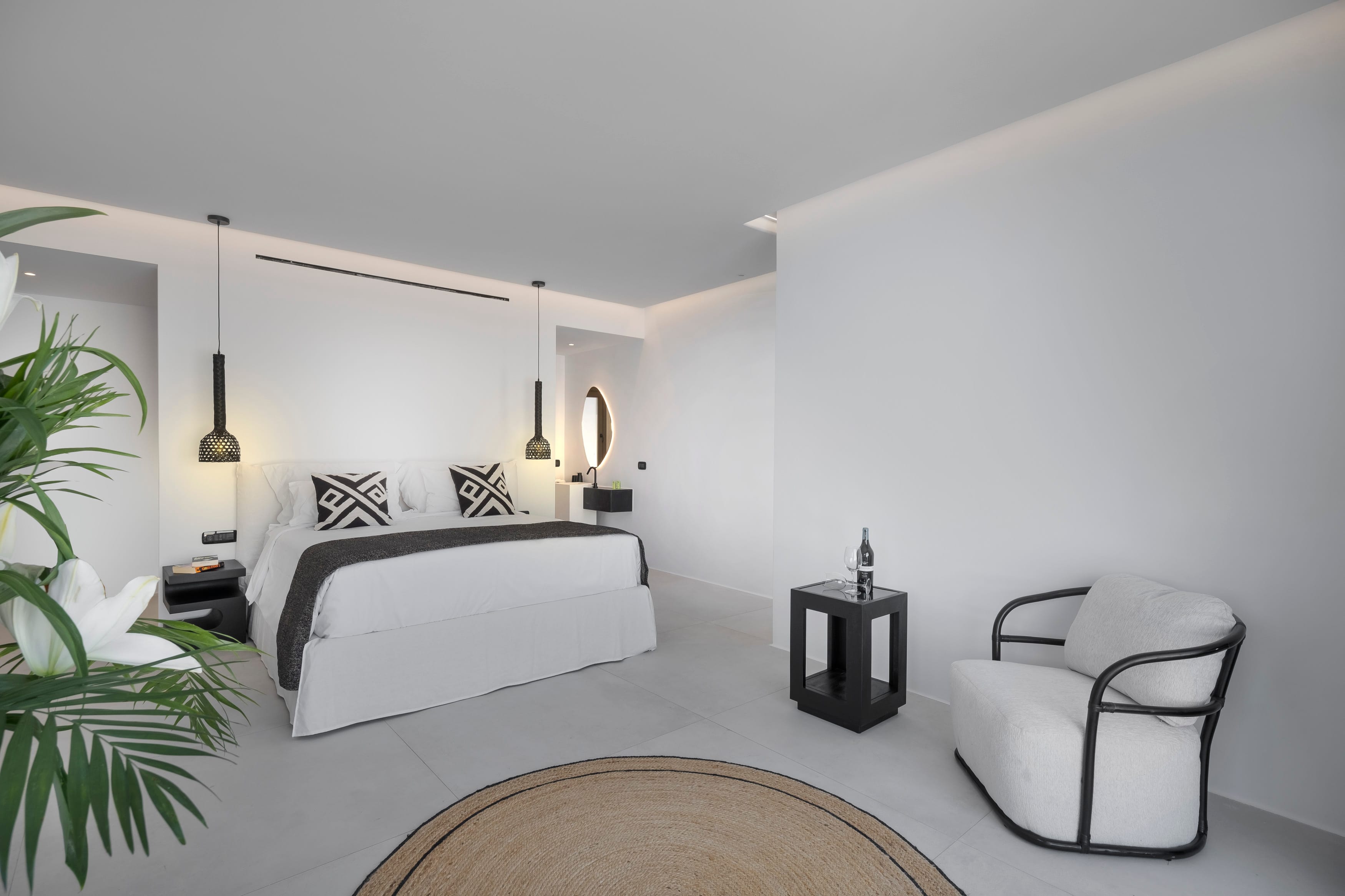 a bedroom with a bed and a chair