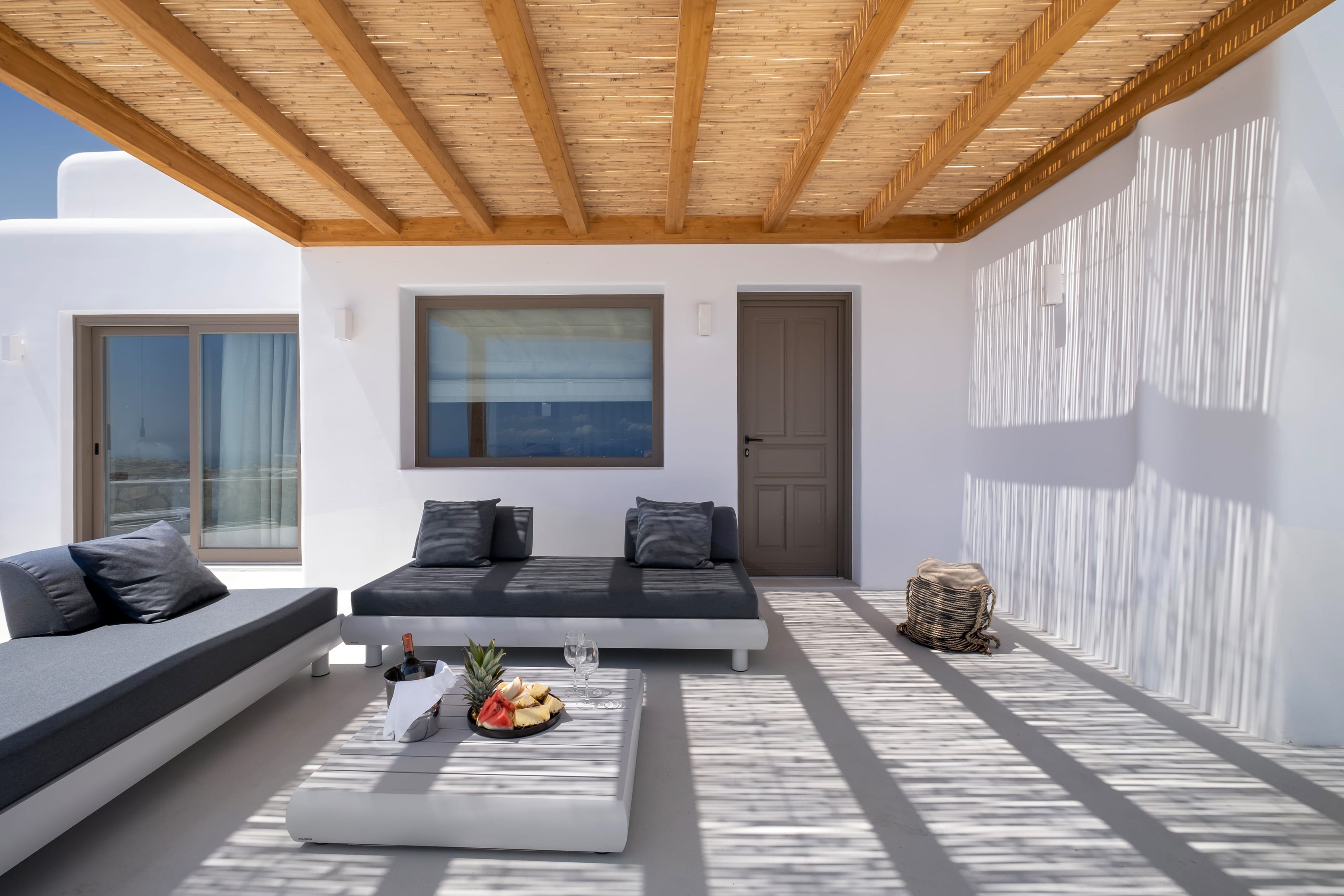 a living room with a wood ceiling