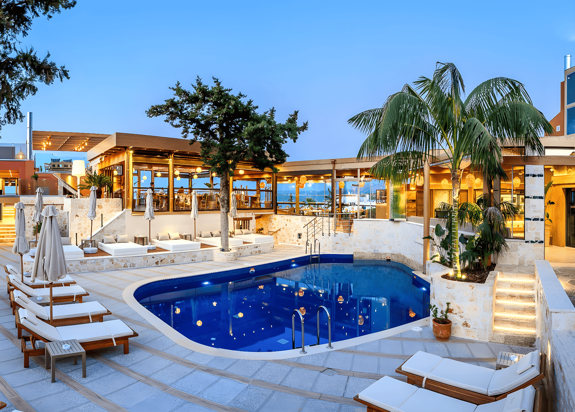 a pool with chairs and umbrellas