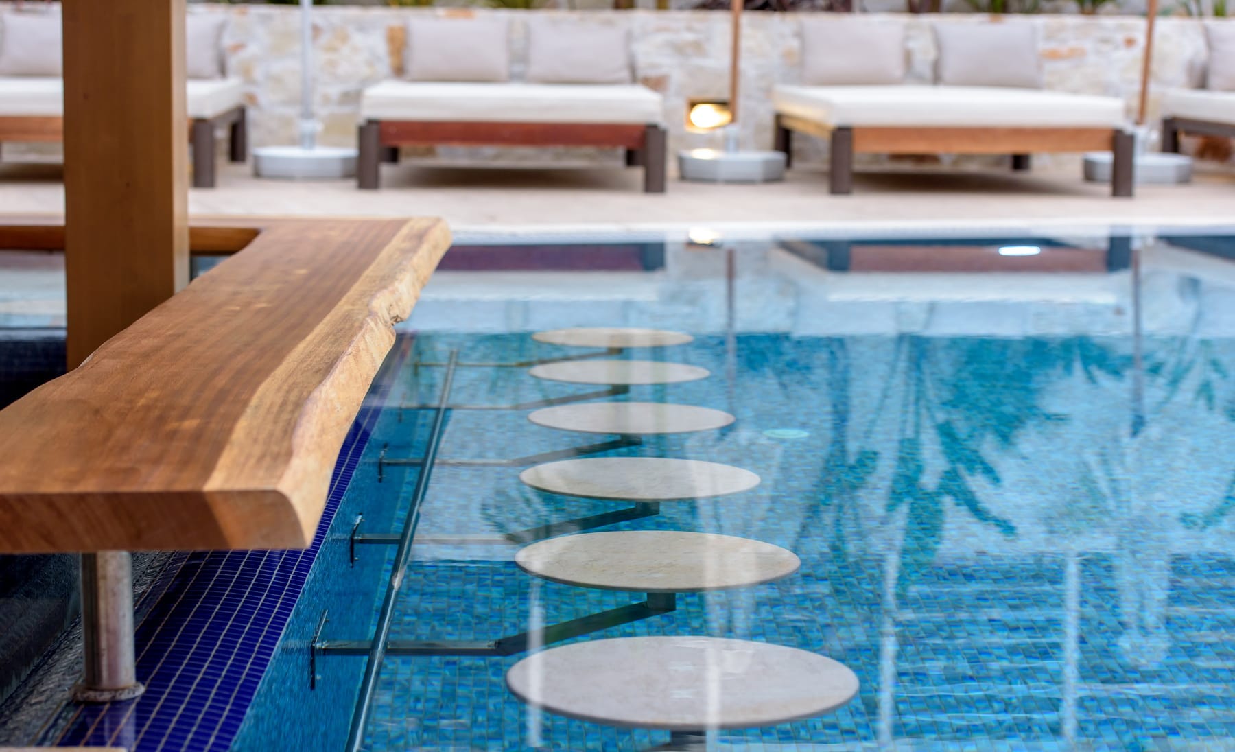 a swimming pool with a bench