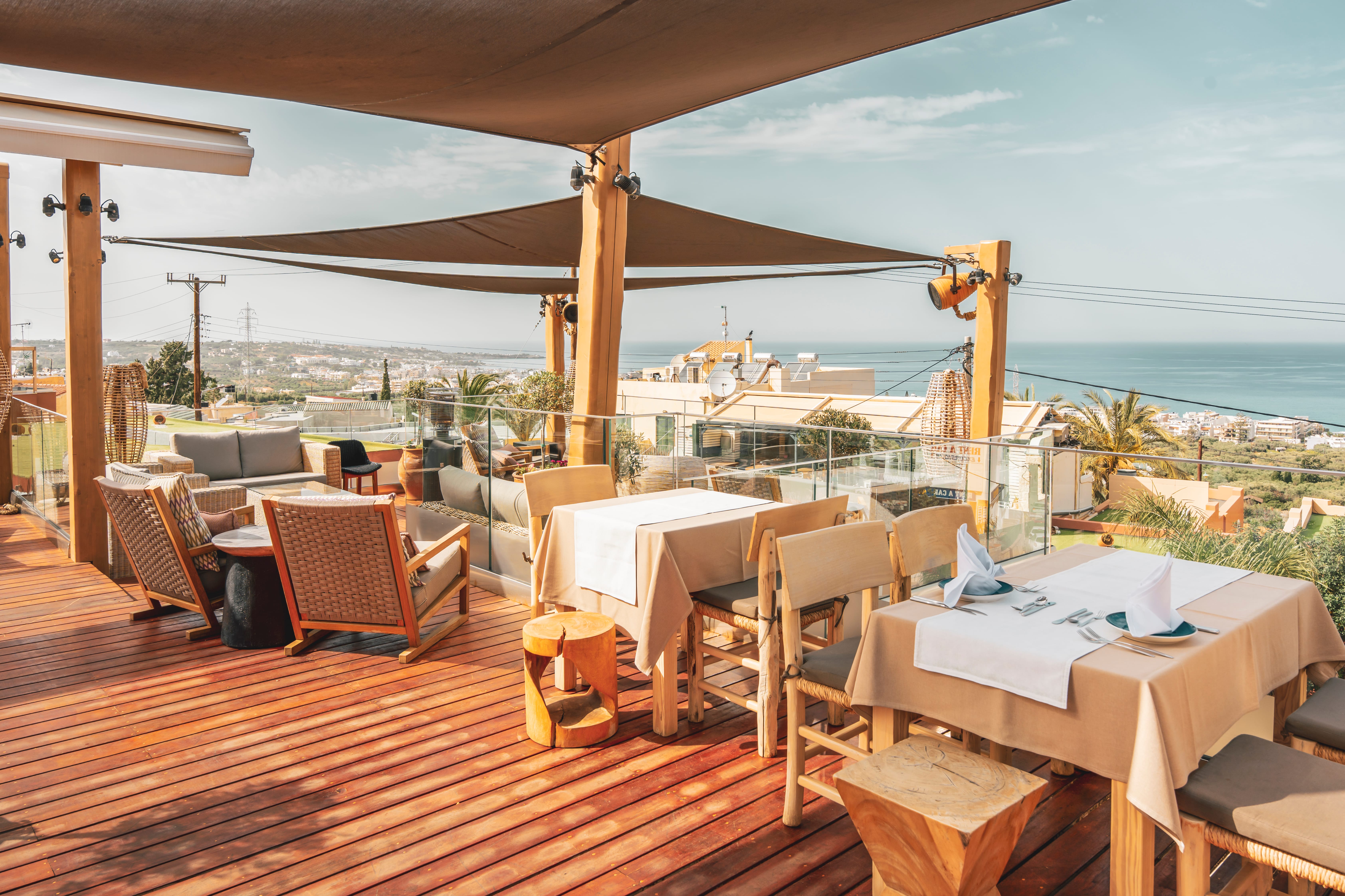 a deck with tables and chairs