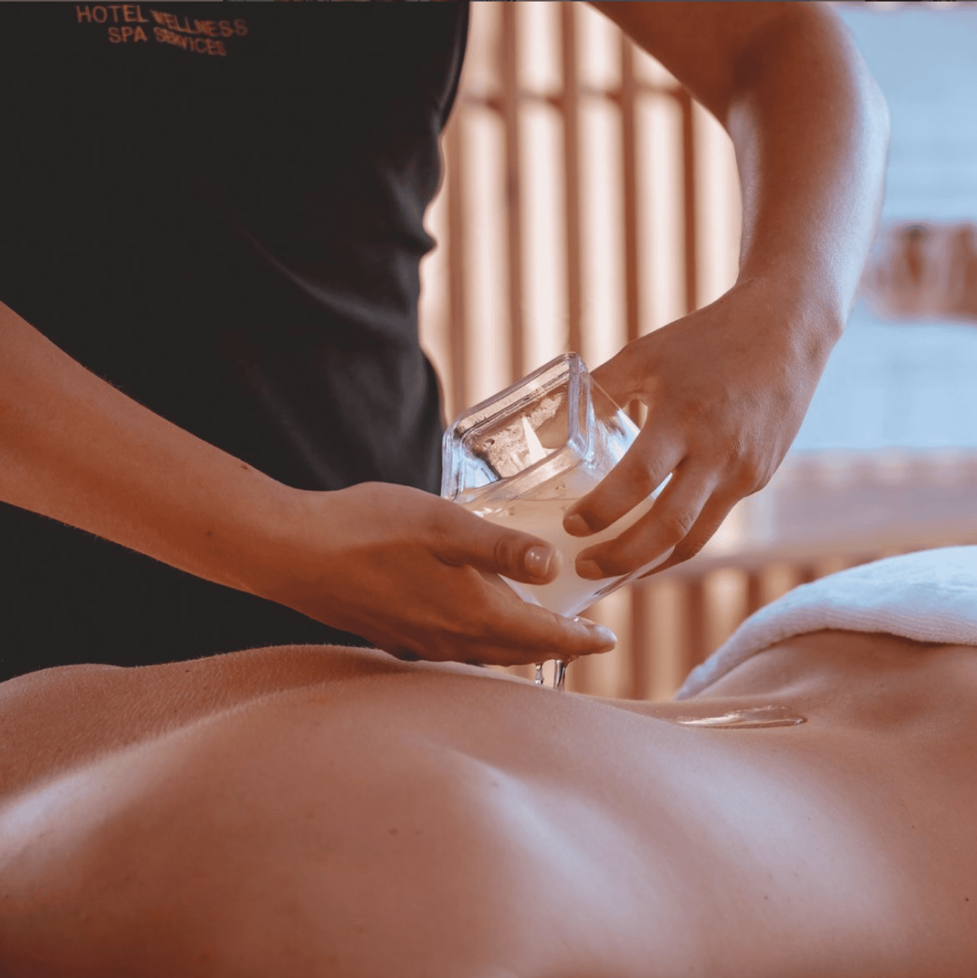 a person holding a glass