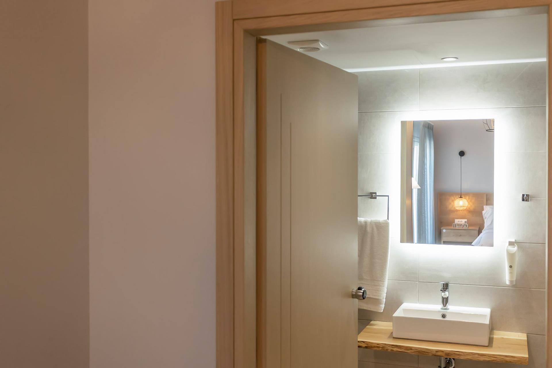 a bathroom with a mirror and sink