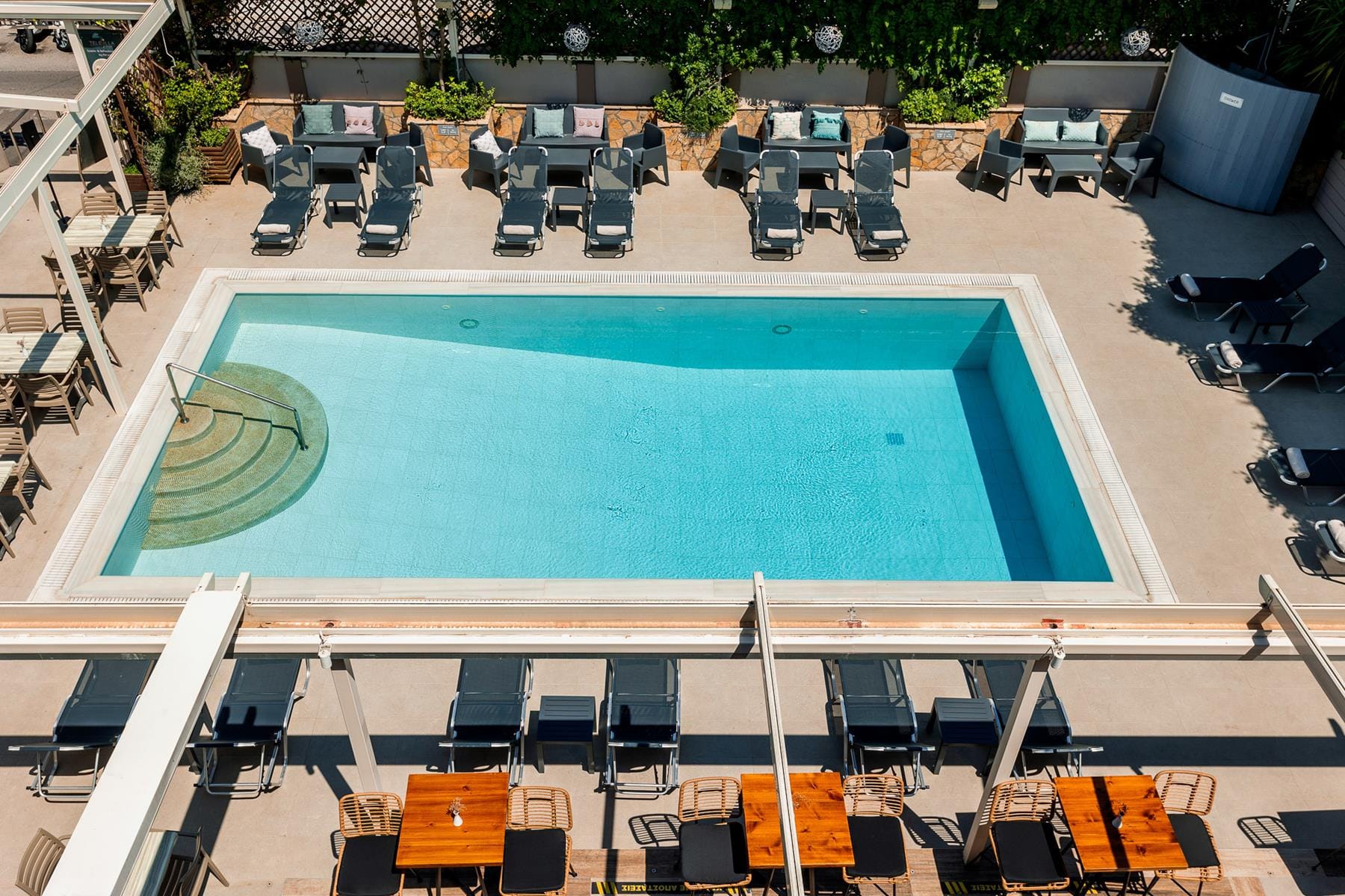 a pool with chairs around it
