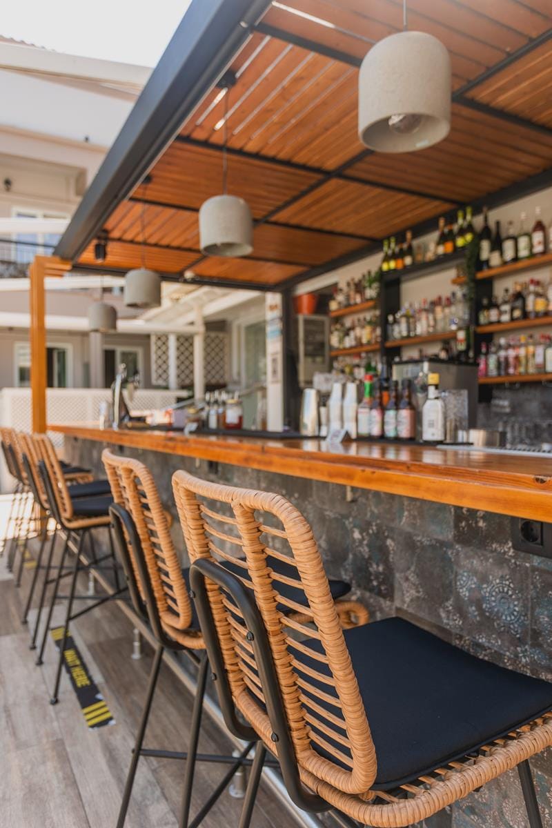 a bar with chairs and tables