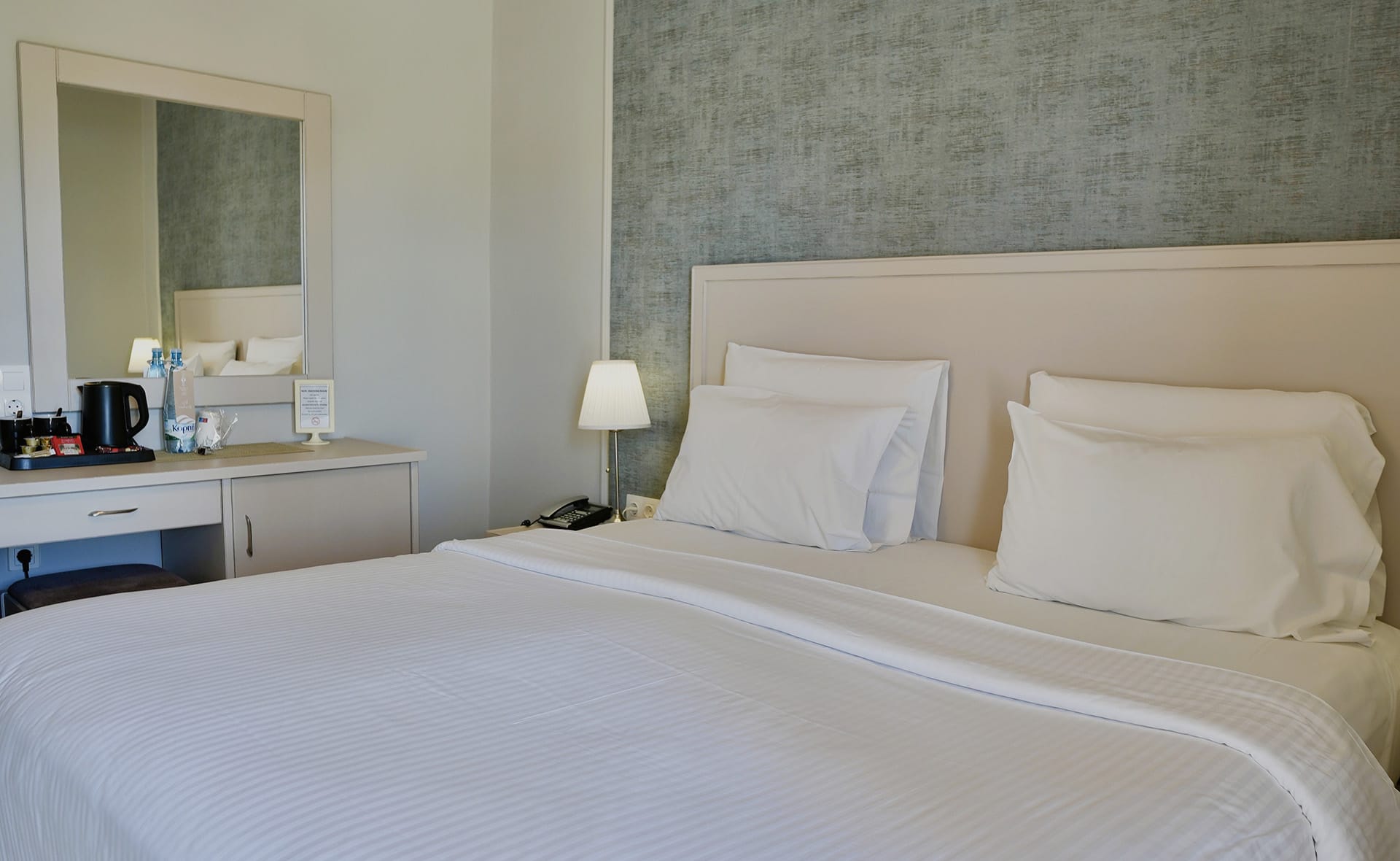 a bed with white sheets