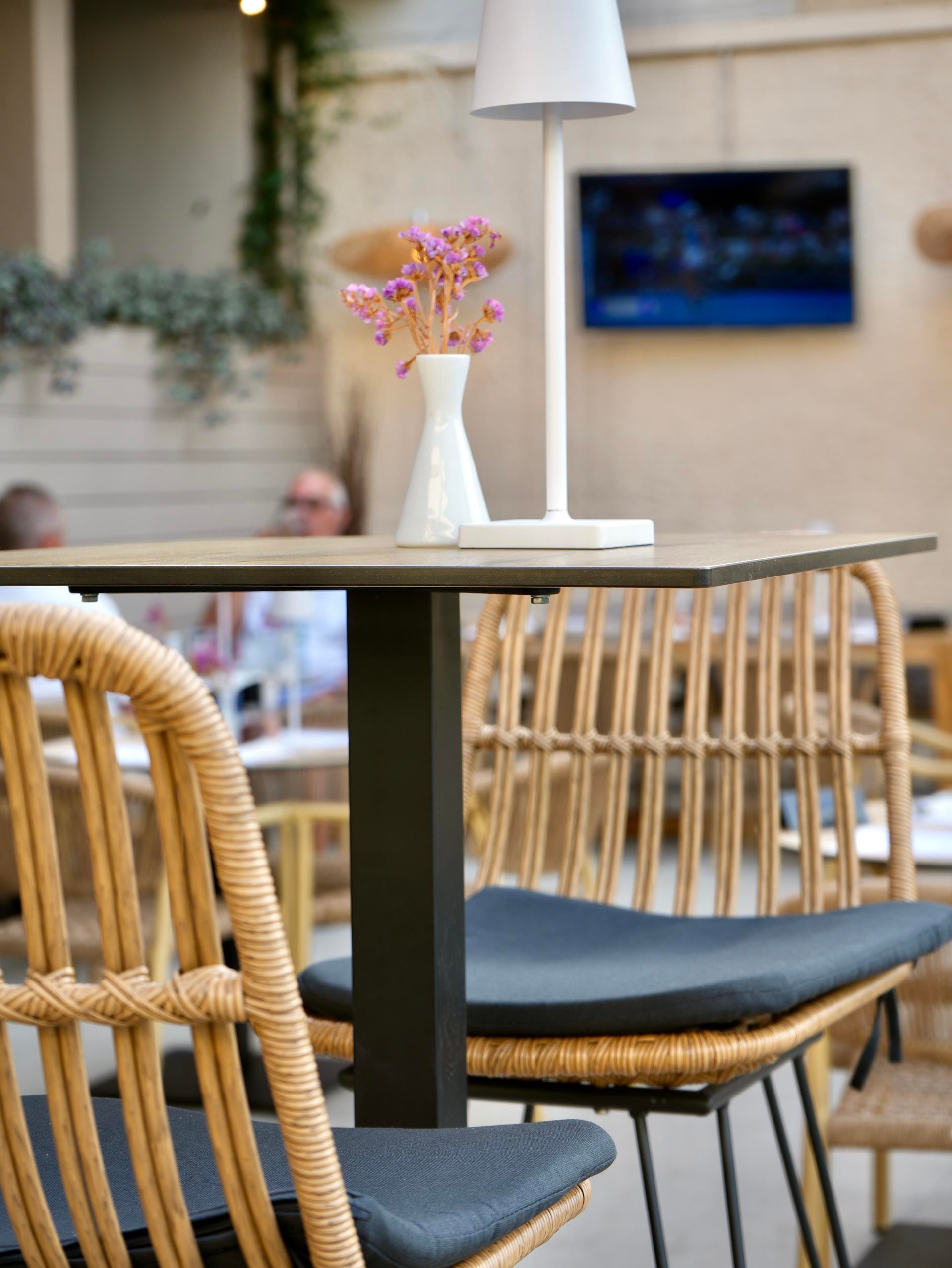 a vase with flowers on a table