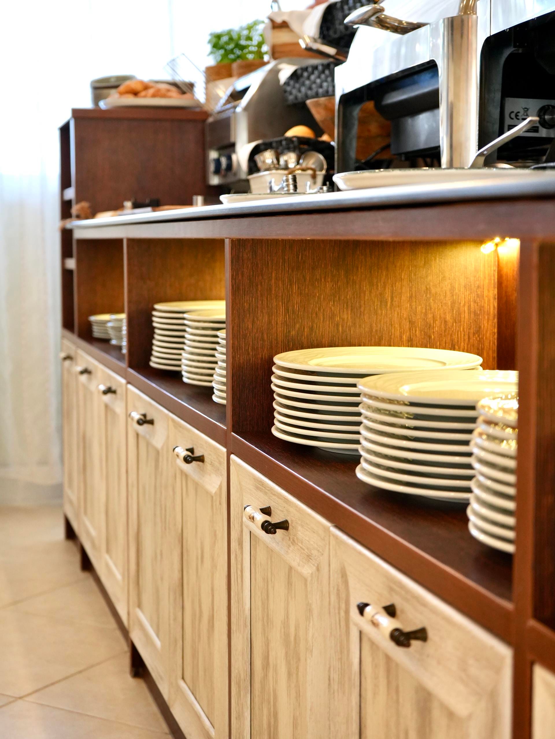 a kitchen with a countertop and white plates