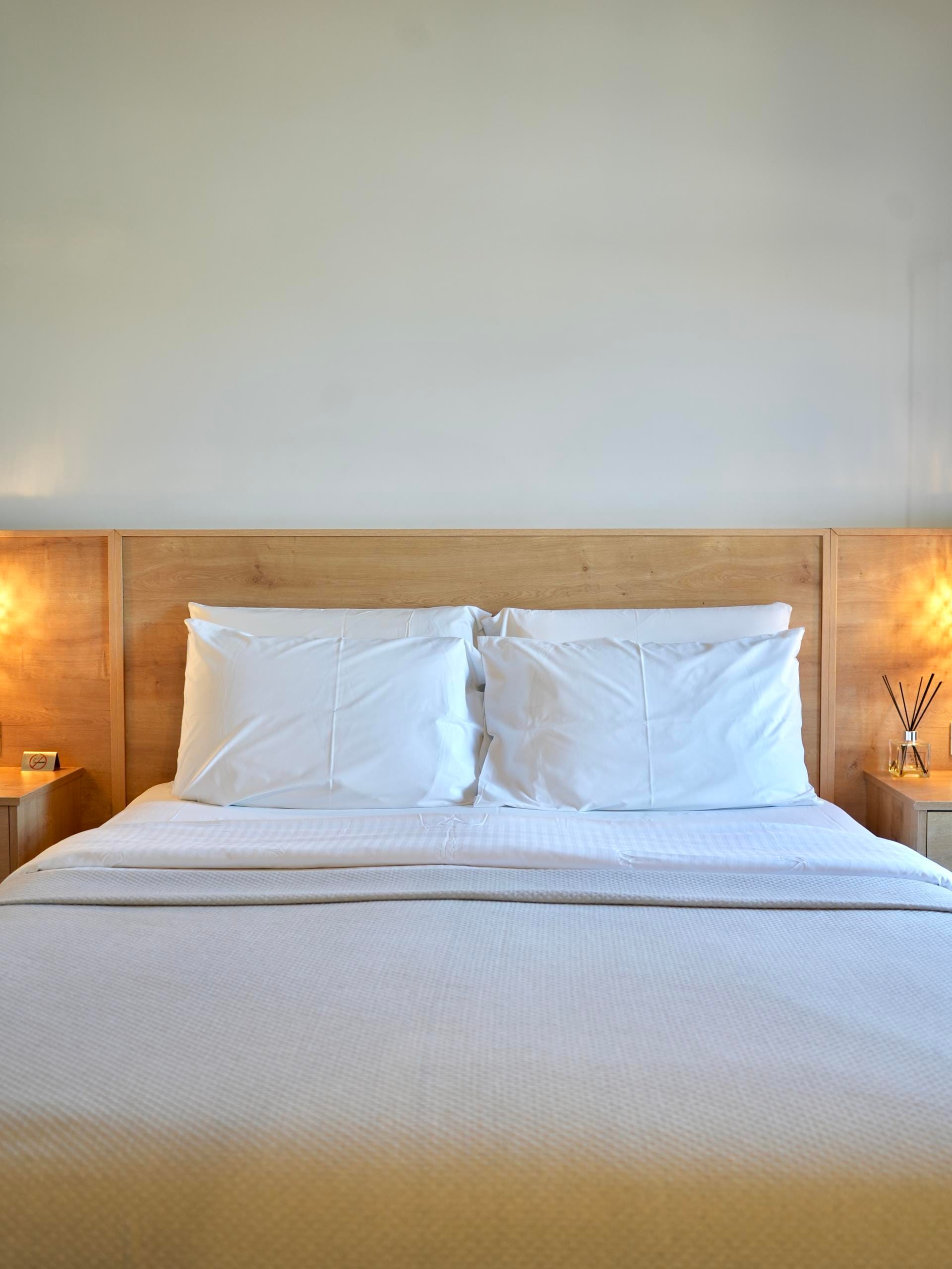 a bed with white sheets