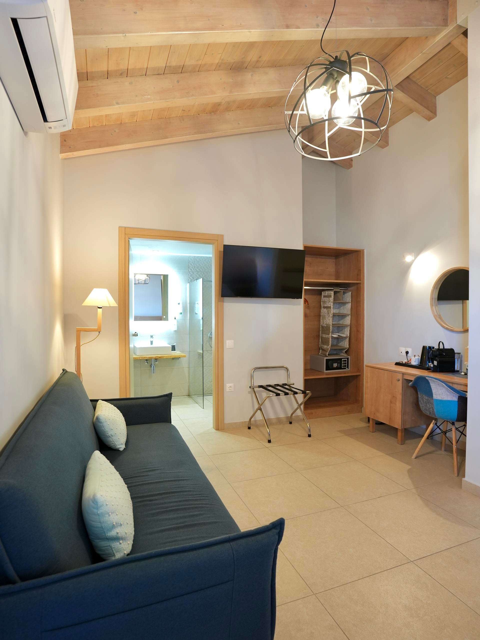 a living room with a blue couch