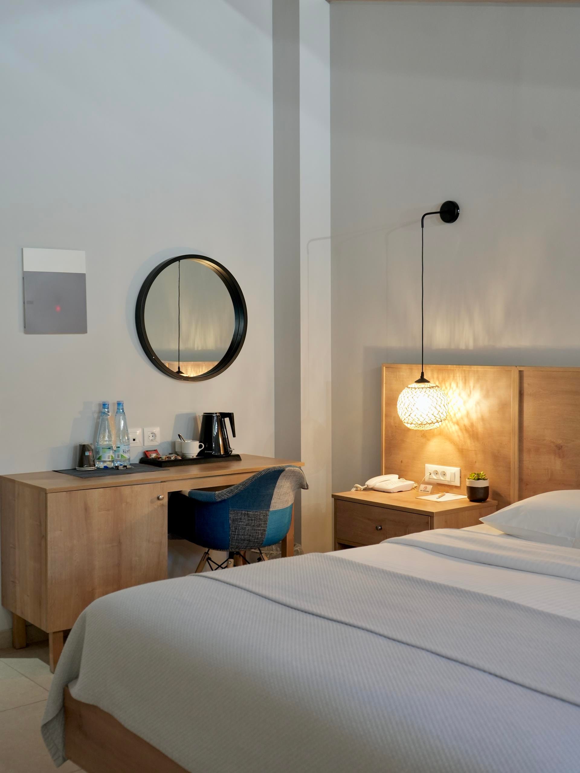 a hotel room with a mirror