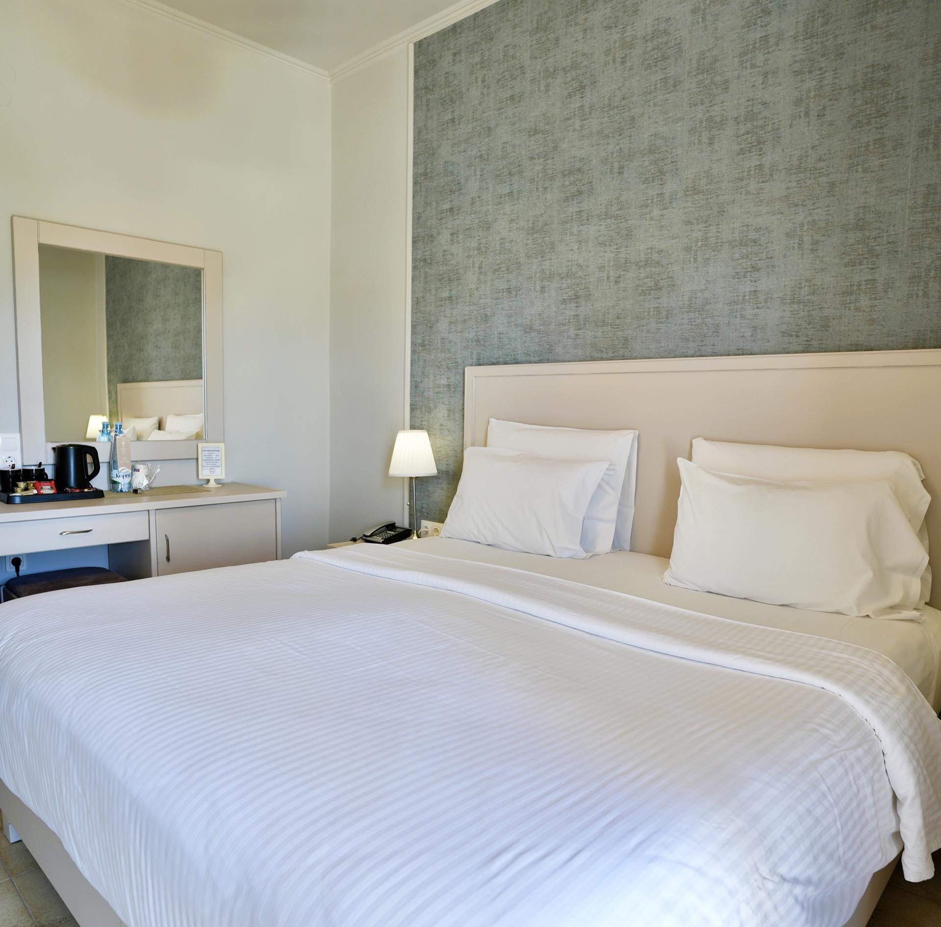 a bed with a white bed spread