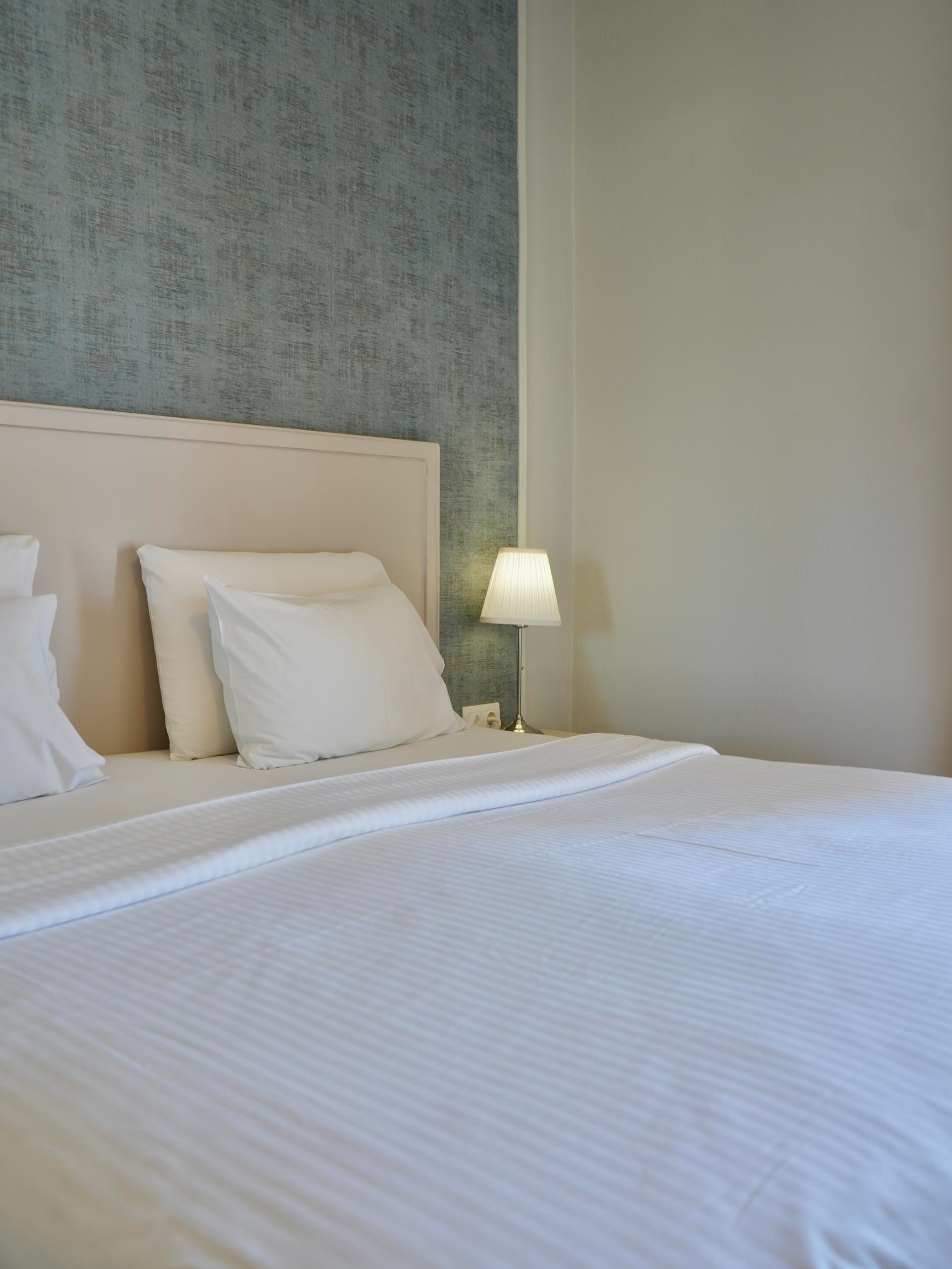 a bed with a white bed spread