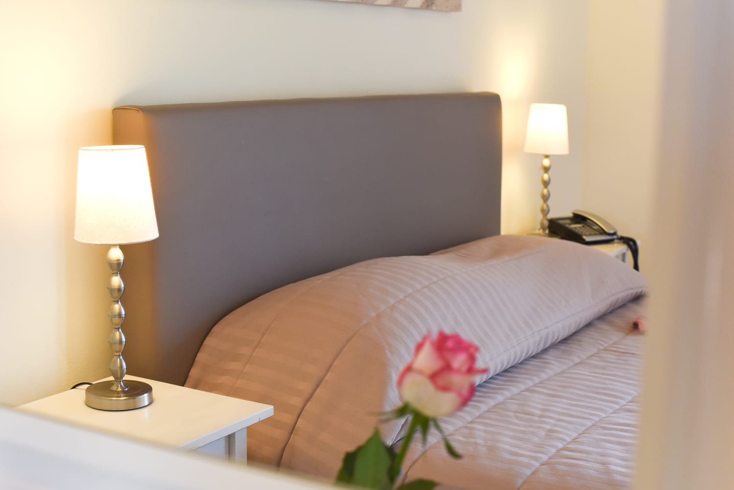 a bed with a flower on it