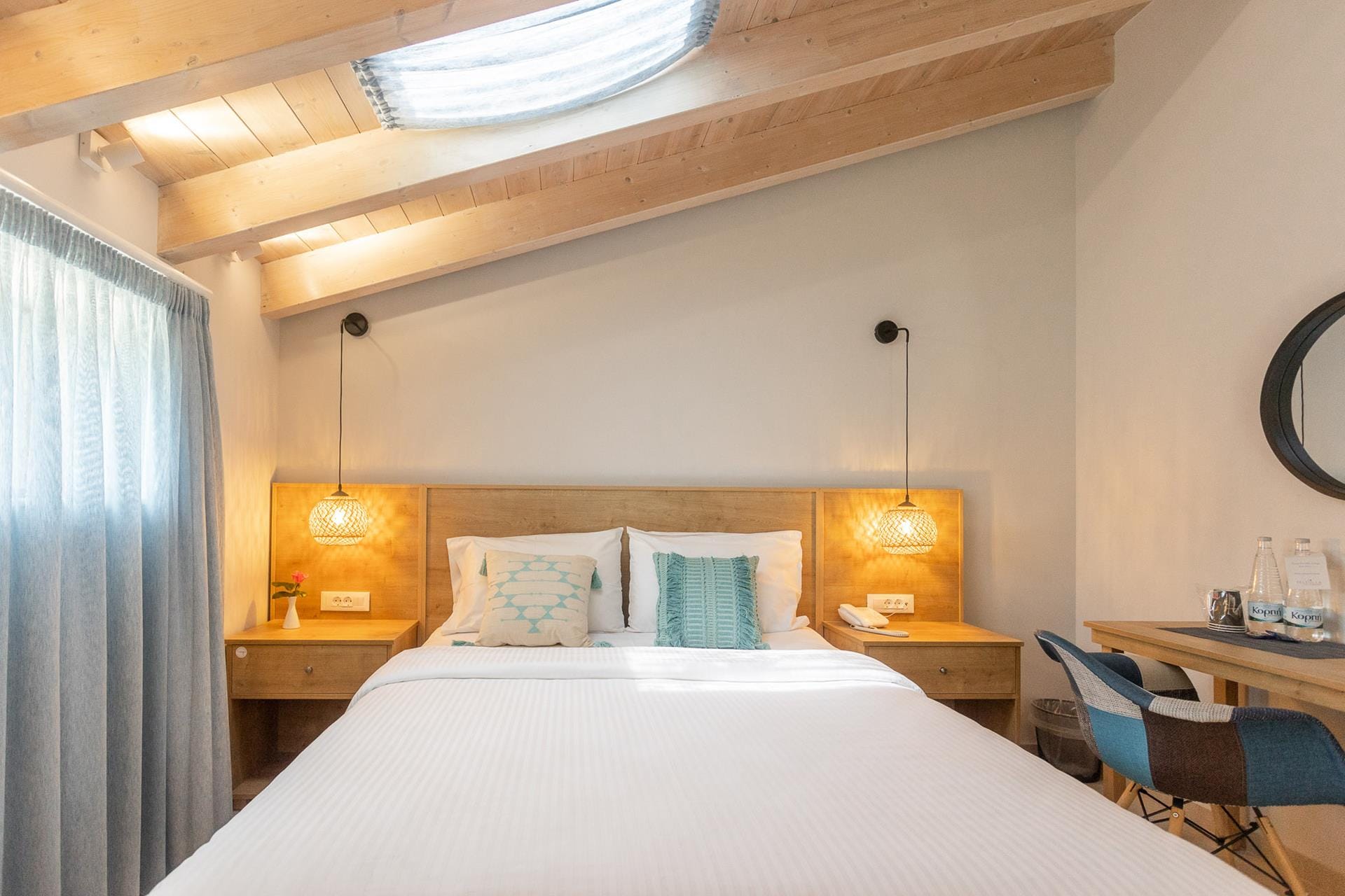 a hotel room with a bed and desk