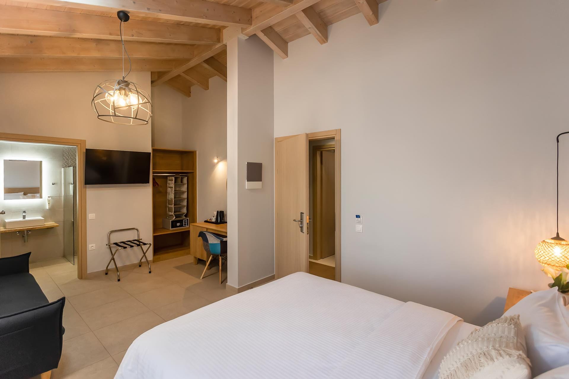 a bedroom with a bed and a couch