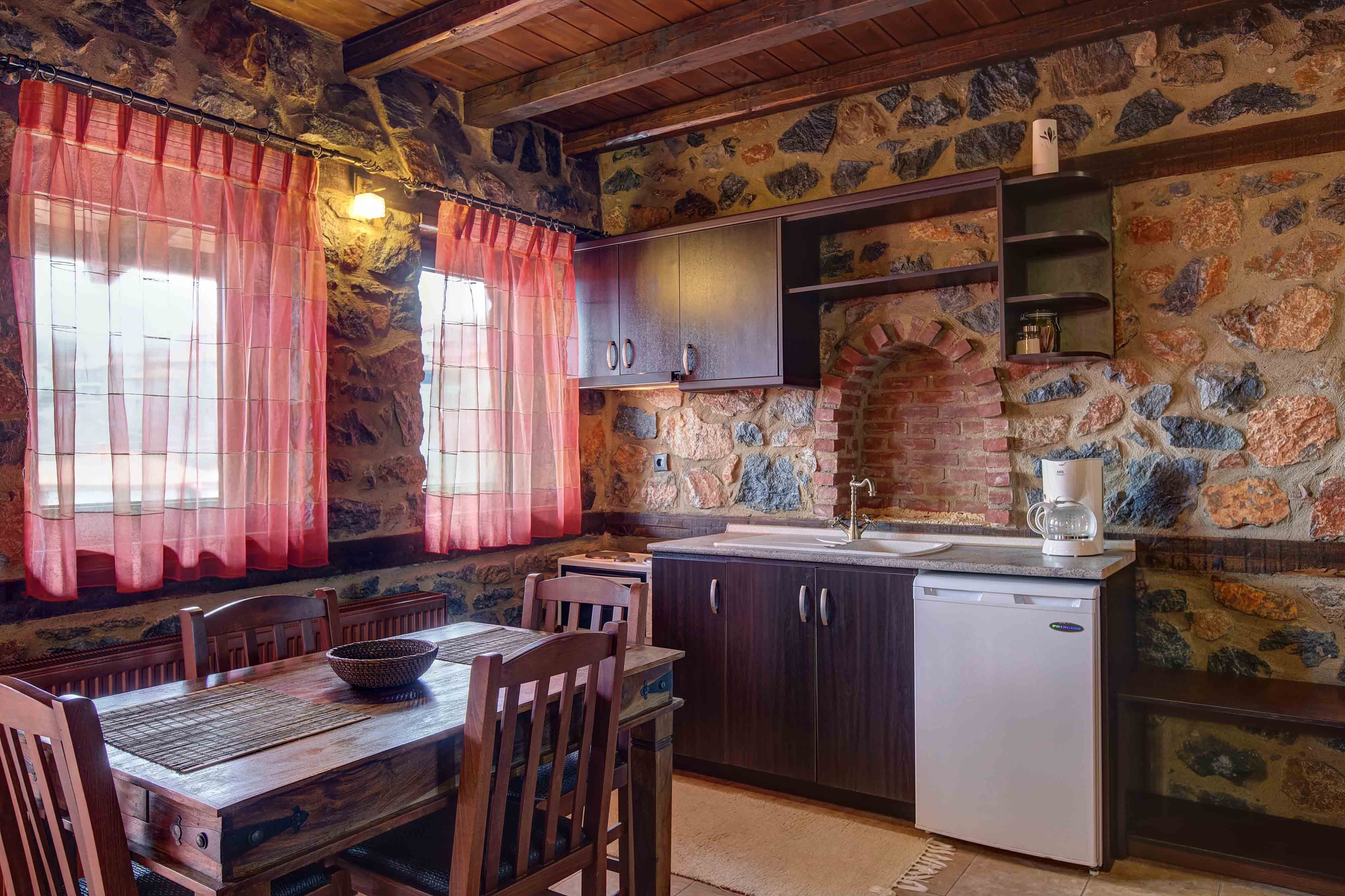 a kitchen with a table and chairs