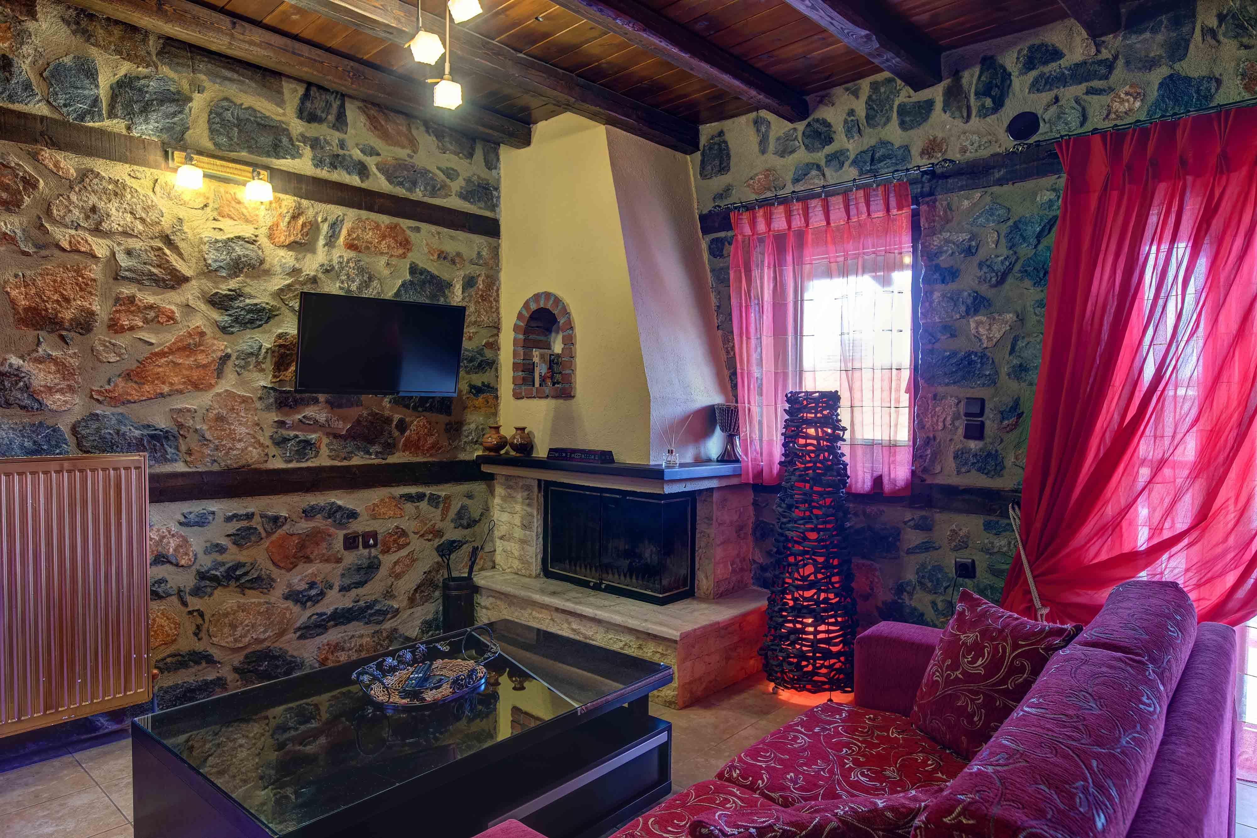 a living room with a red couch