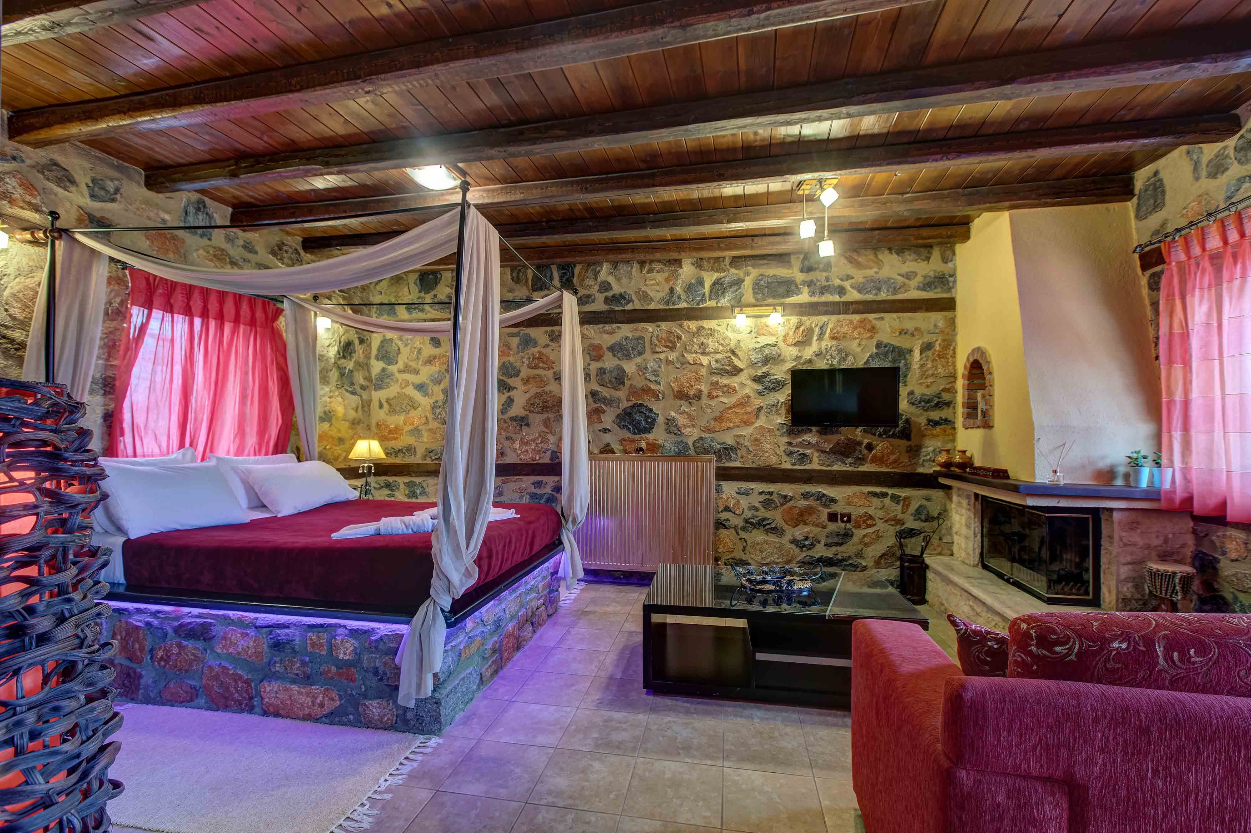 a bedroom with a bed and a fireplace