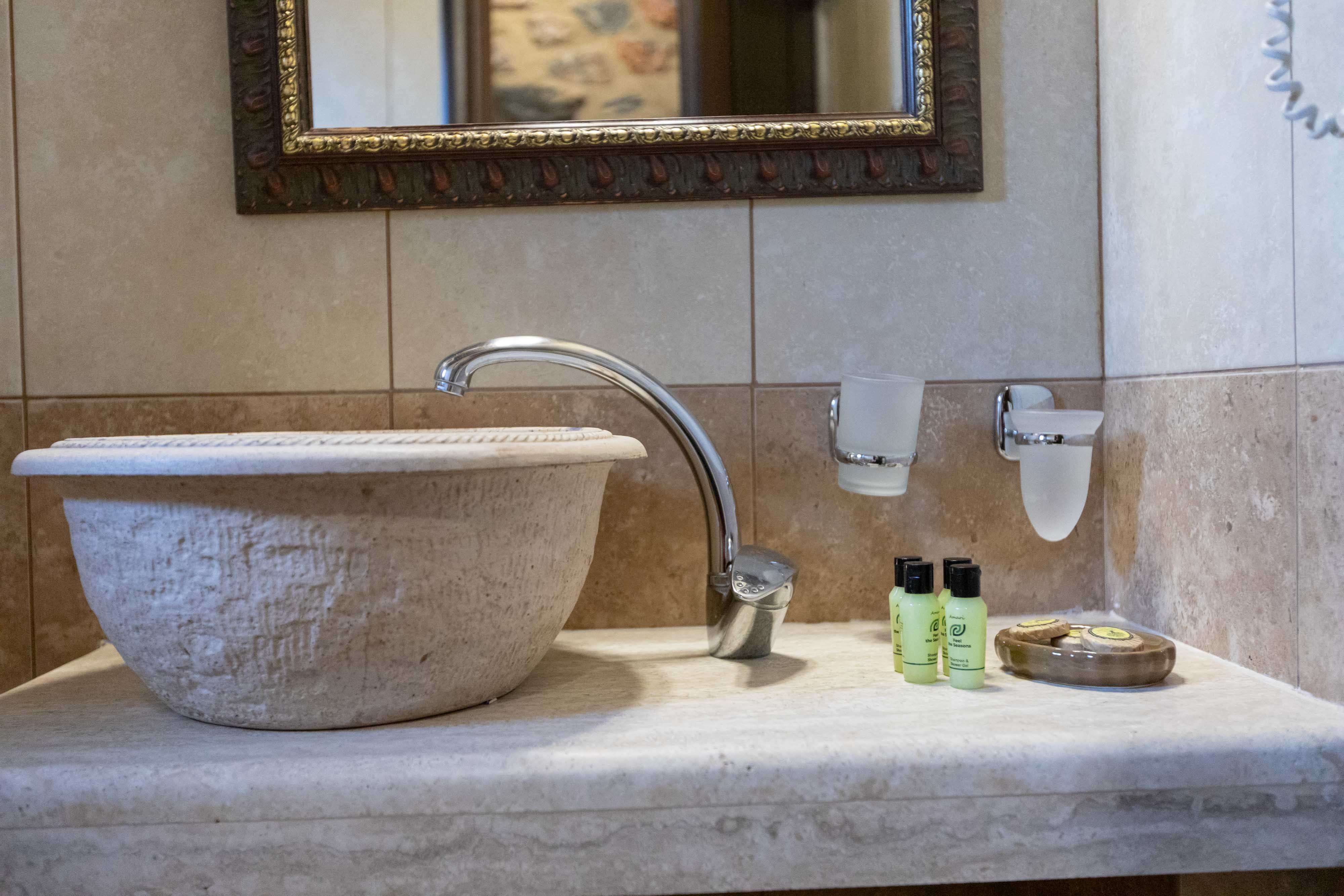 a sink with a mirror above it