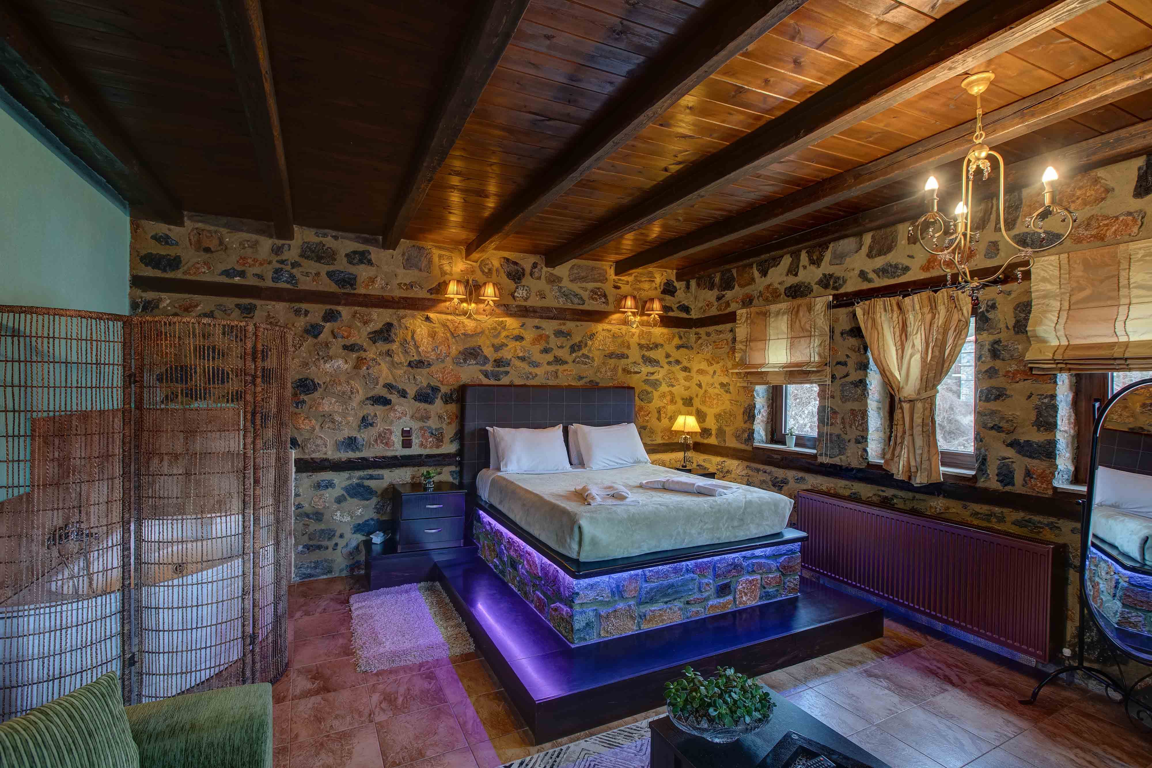 a bedroom with a bed and a couch